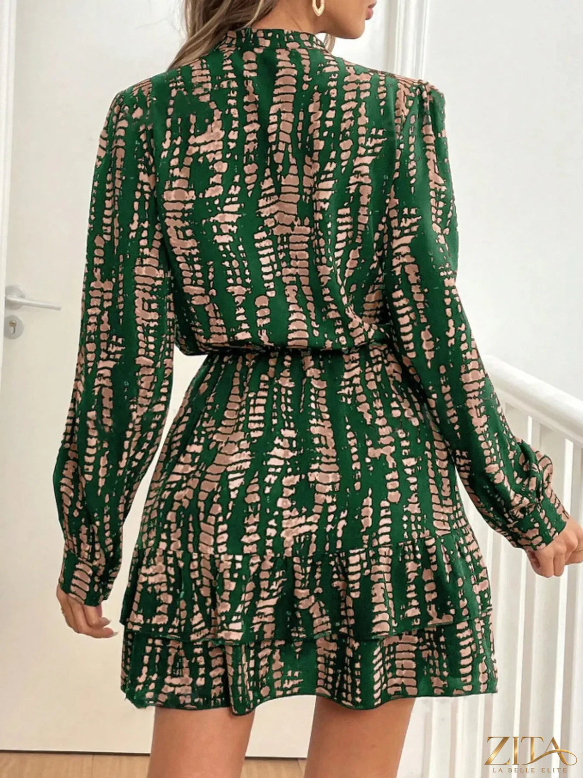 Printed long sleeve mini dress by Zita La Belle Elite featuring a stylish pattern and a fitted silhouette.