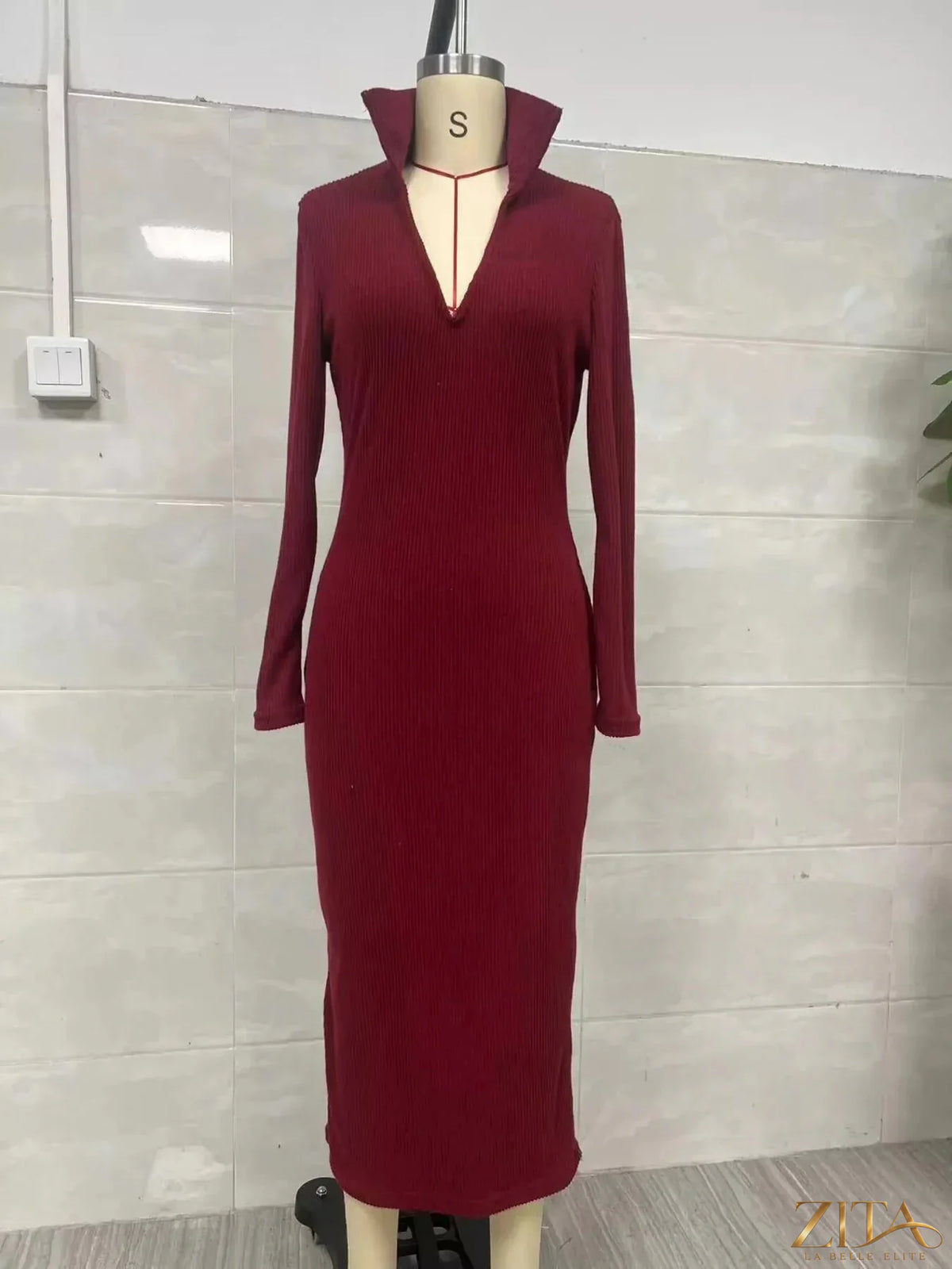 Zita La Belle Elite ribbed knit V-neck sweater dress in neutral color, showcasing its fitted design and textured fabric.