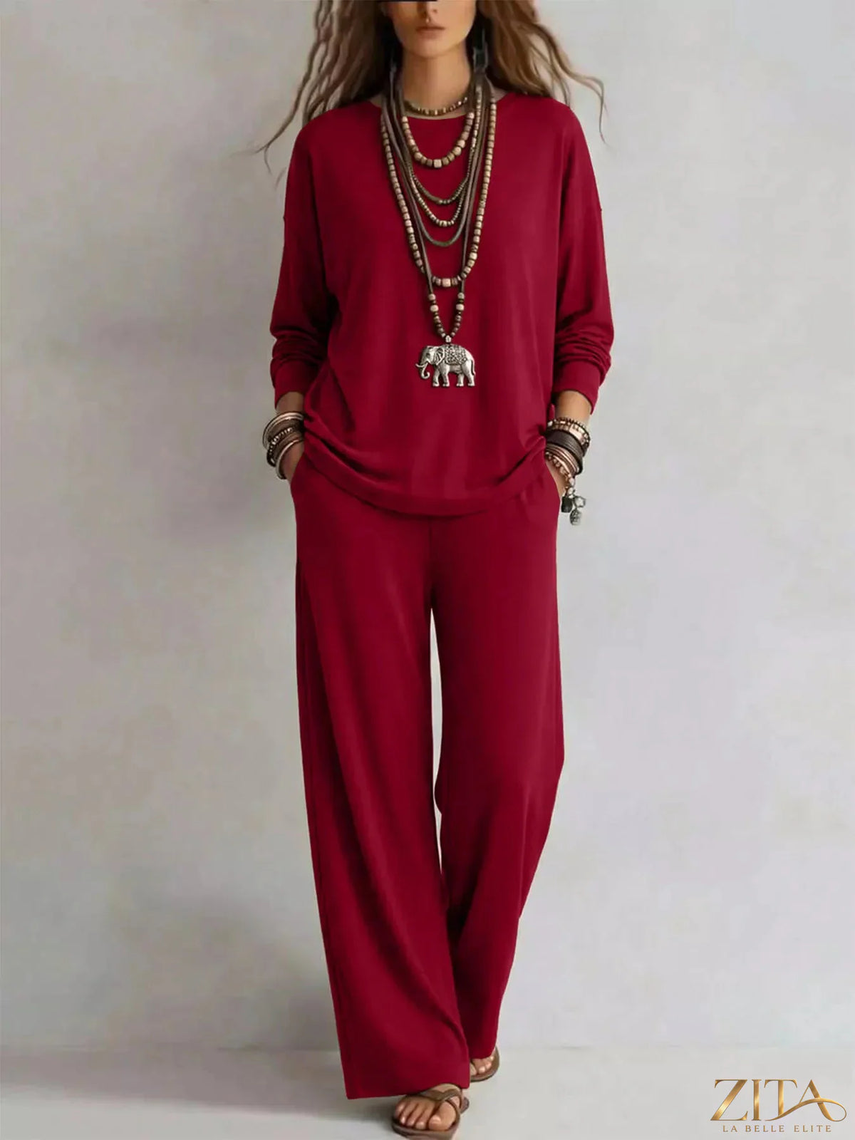 Zita La Belle Elite round neck T-shirt and wide-leg pants set in soft fabric, displayed on a hanger against a white background.