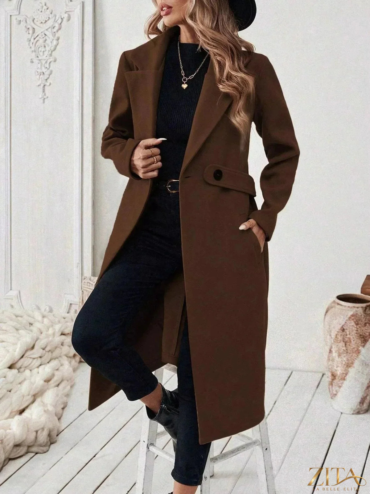 Zita La Belle Elite single-button longline coat in neutral fabric, front view showing collar, button closure, and sleek silhouette.