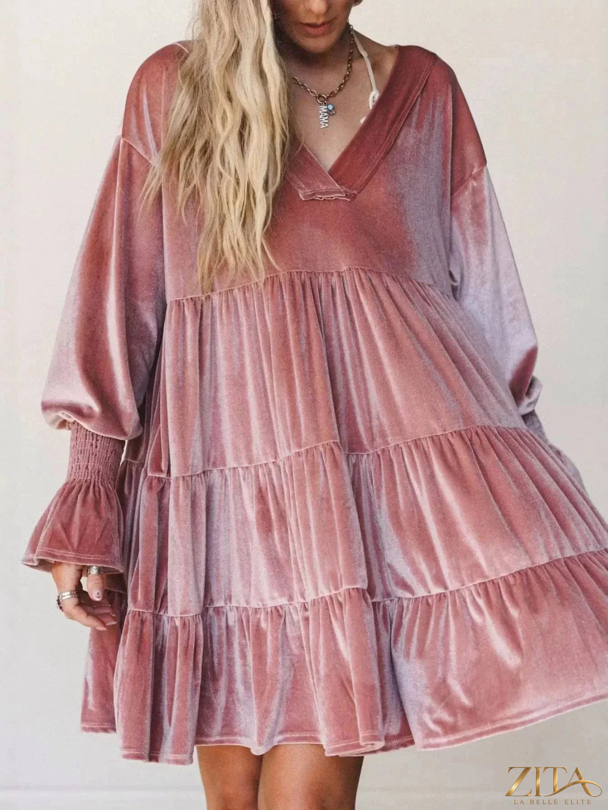 Velvet tiered mini dress with balloon sleeves from Zita La Belle Elite, shown in a stylish close-up of the dress fabric and design.