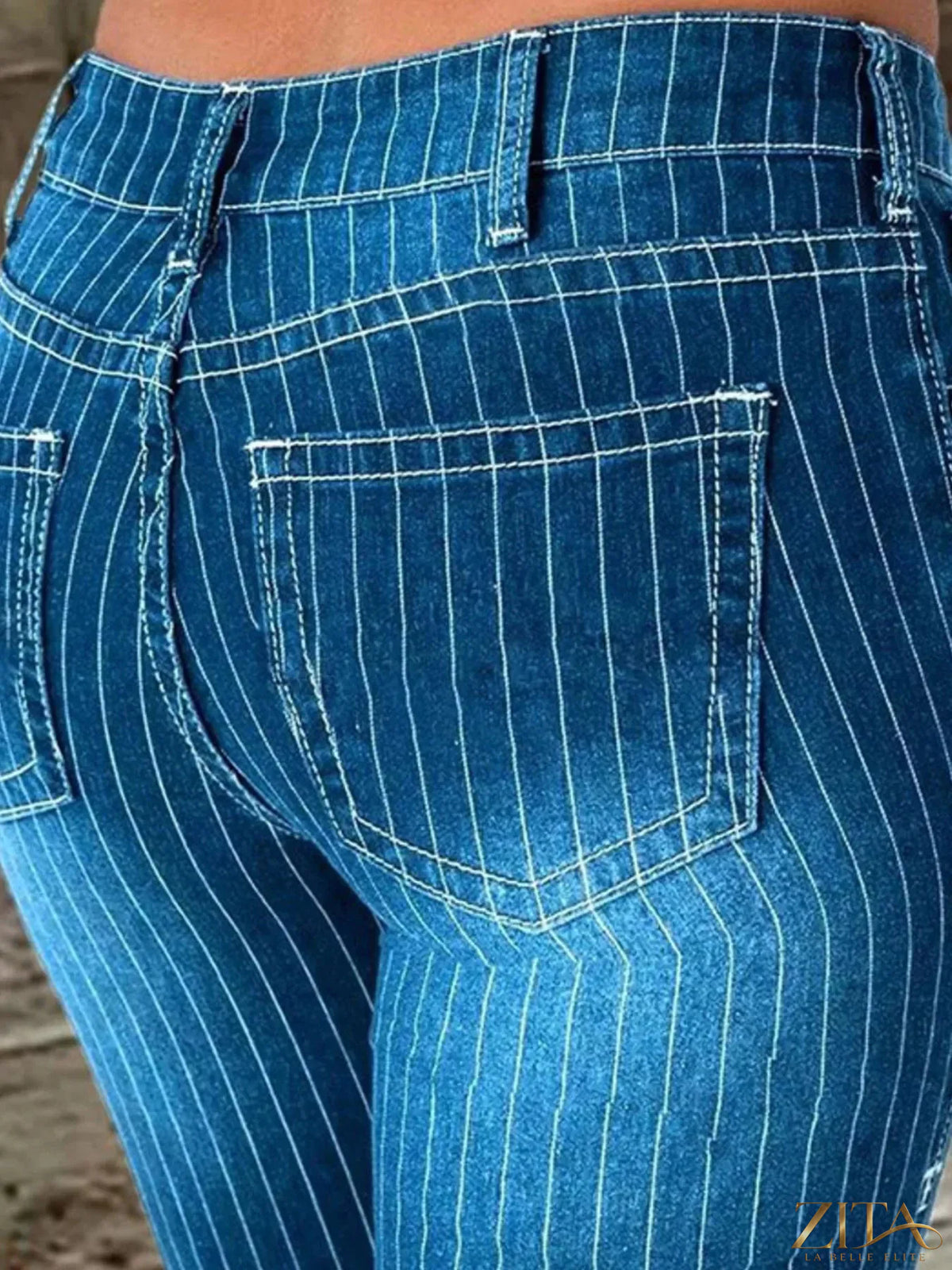 Zita La Belle Elite striped button fly flare jeans with high waist and bold vertical stripes, displayed on a mannequin.