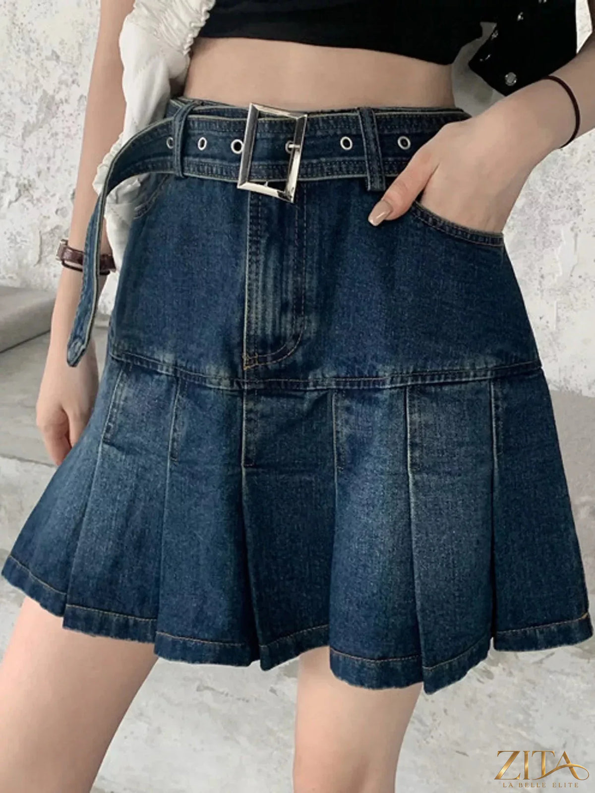 High-waisted pleated denim skirt by Trendsi featuring a stylish, structured design with pleats and a classic denim wash.