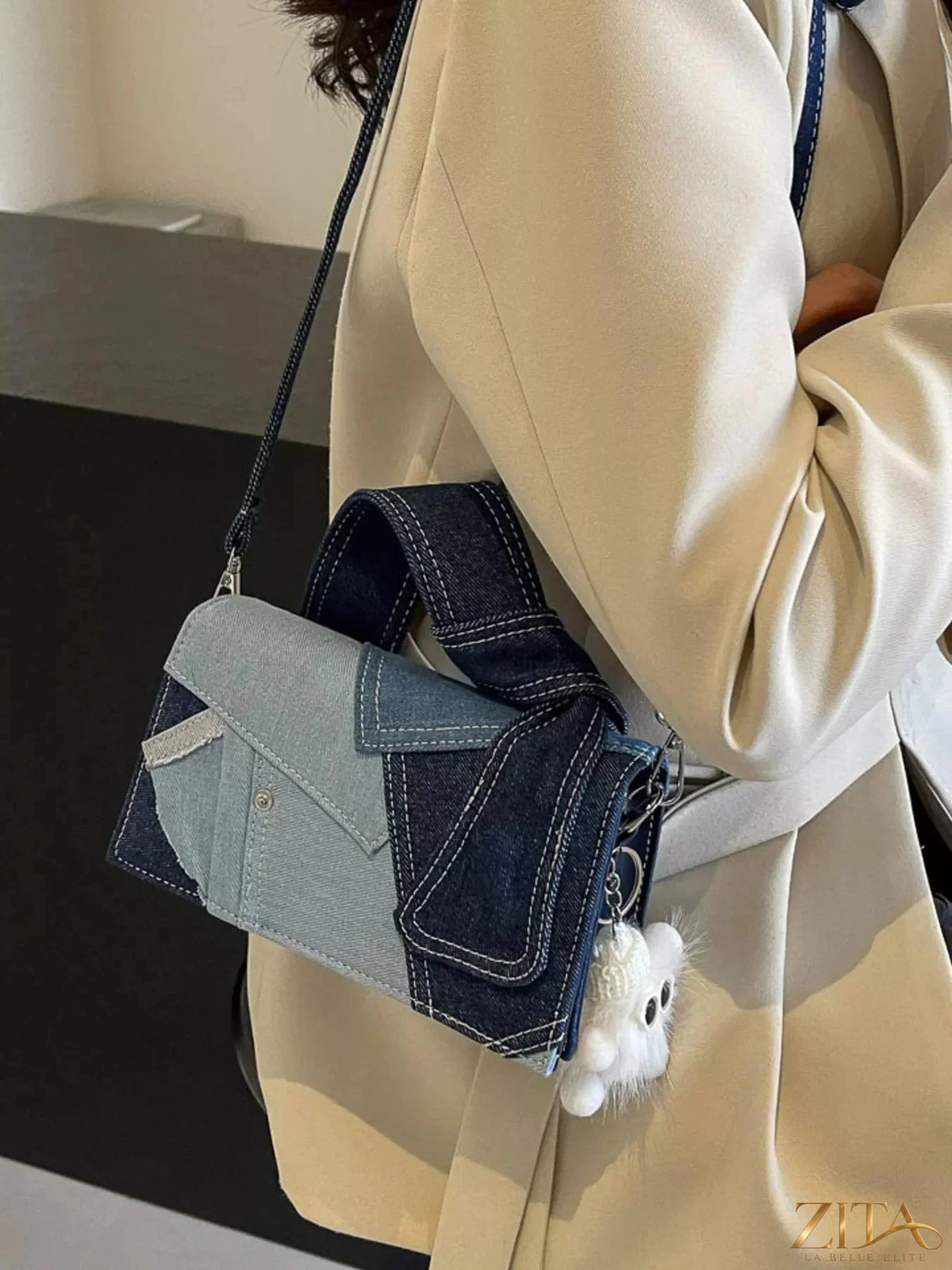Denim patchwork crossbody bag by Zita La Belle Elite, featuring a stylish mixed fabric design and adjustable strap.