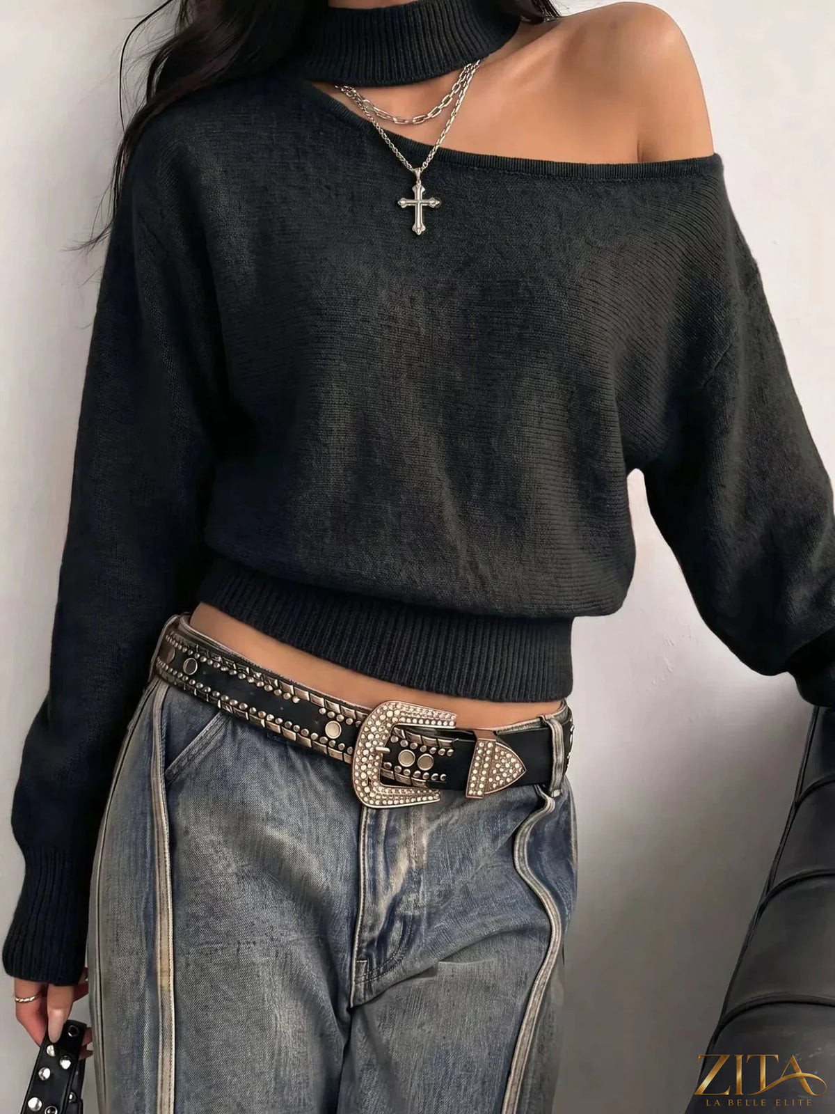 Cold-shoulder dropped shoulder sweater by Trendsi, featuring a cozy knit design with cut-out shoulders and relaxed fit.