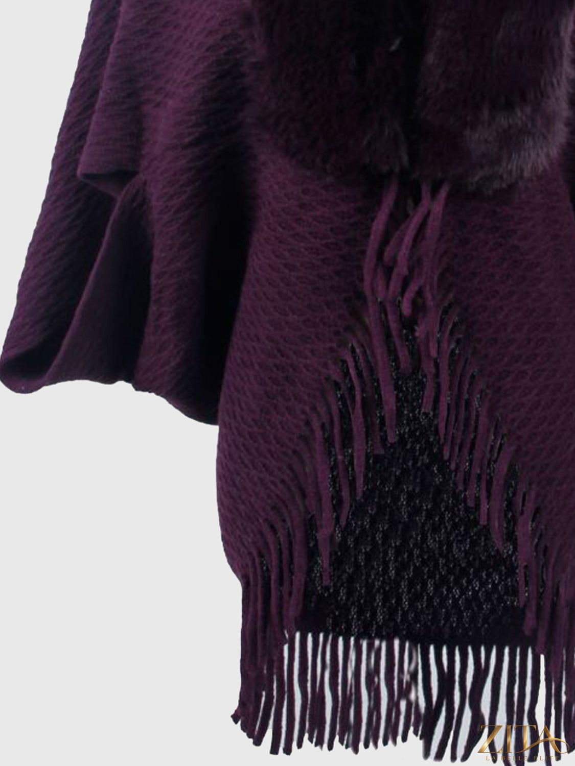 Open front fringe hem poncho from Trendsi featuring a relaxed fit and stylish fringe detailing on the hem.