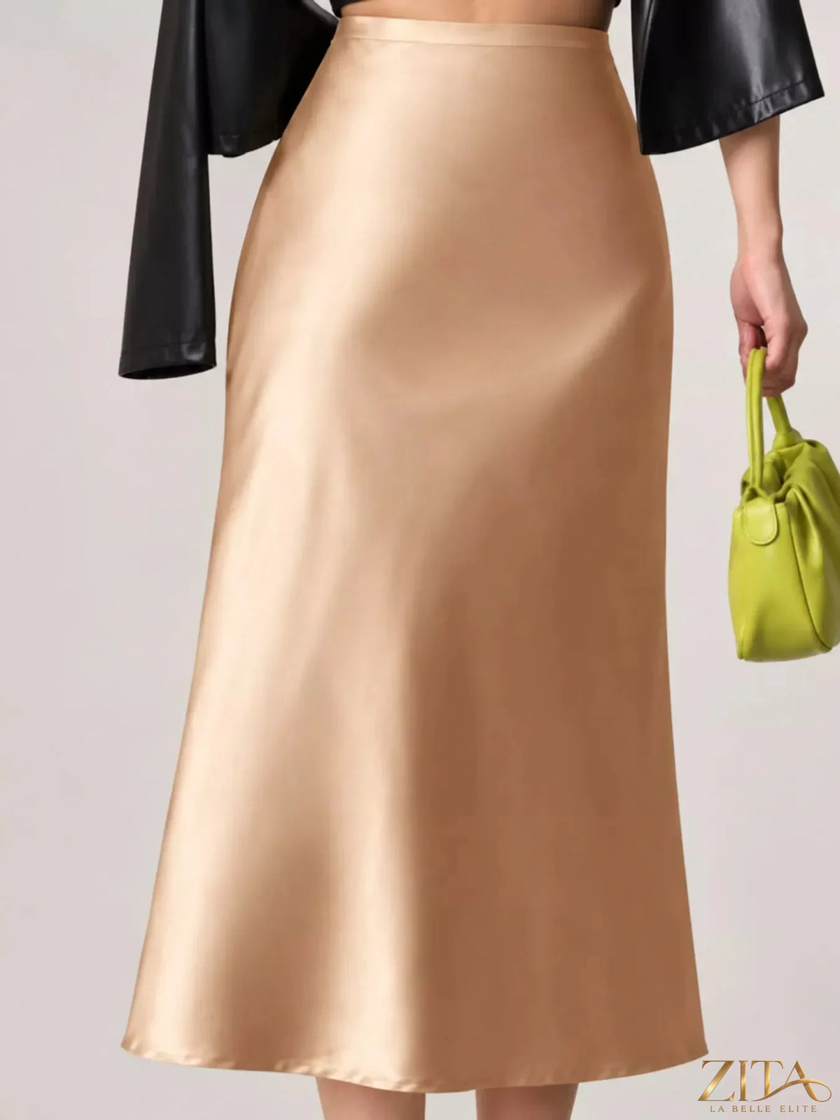 High-waisted satin midi skirt in a sleek design, featuring a smooth, glossy fabric and a flattering fit.