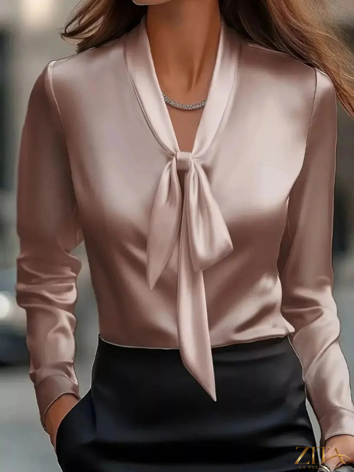 Zita La Belle Elite satin tie-front long sleeve blouse with V-neck and elegant draped design, styled with a neutral background.