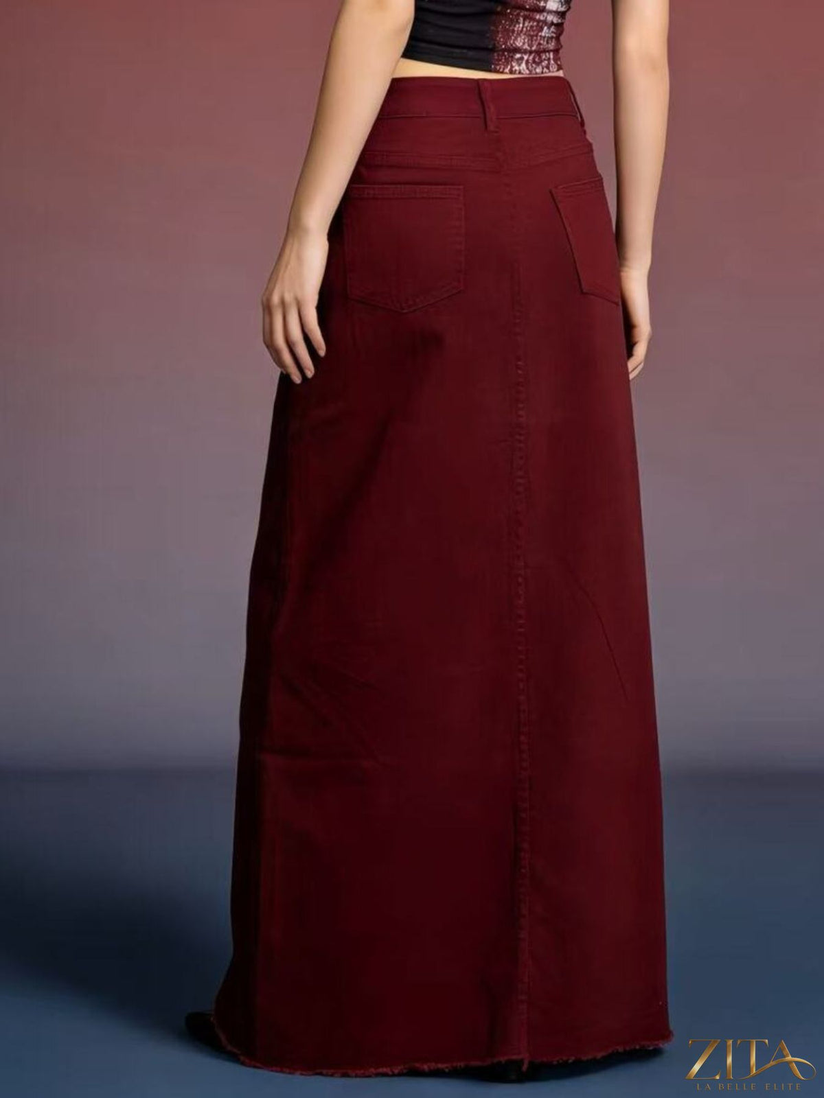 Raw hem maxi denim skirt by Zita La Belle Elite featuring a flowing silhouette and distressed hem detail.