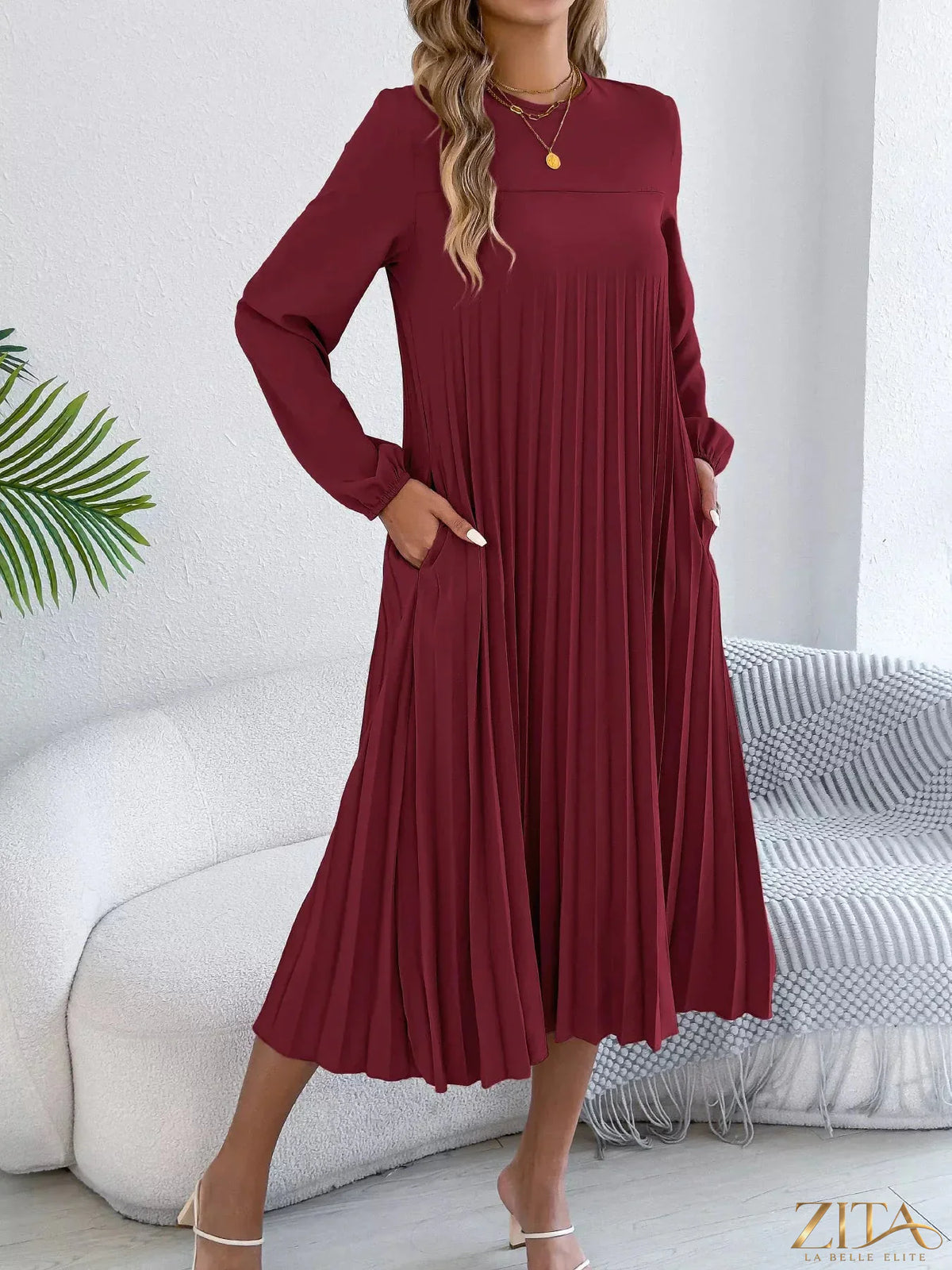 Zita La Belle Elite pleated A-line midi dress featuring a flowy silhouette and elegant design suitable for various occasions.