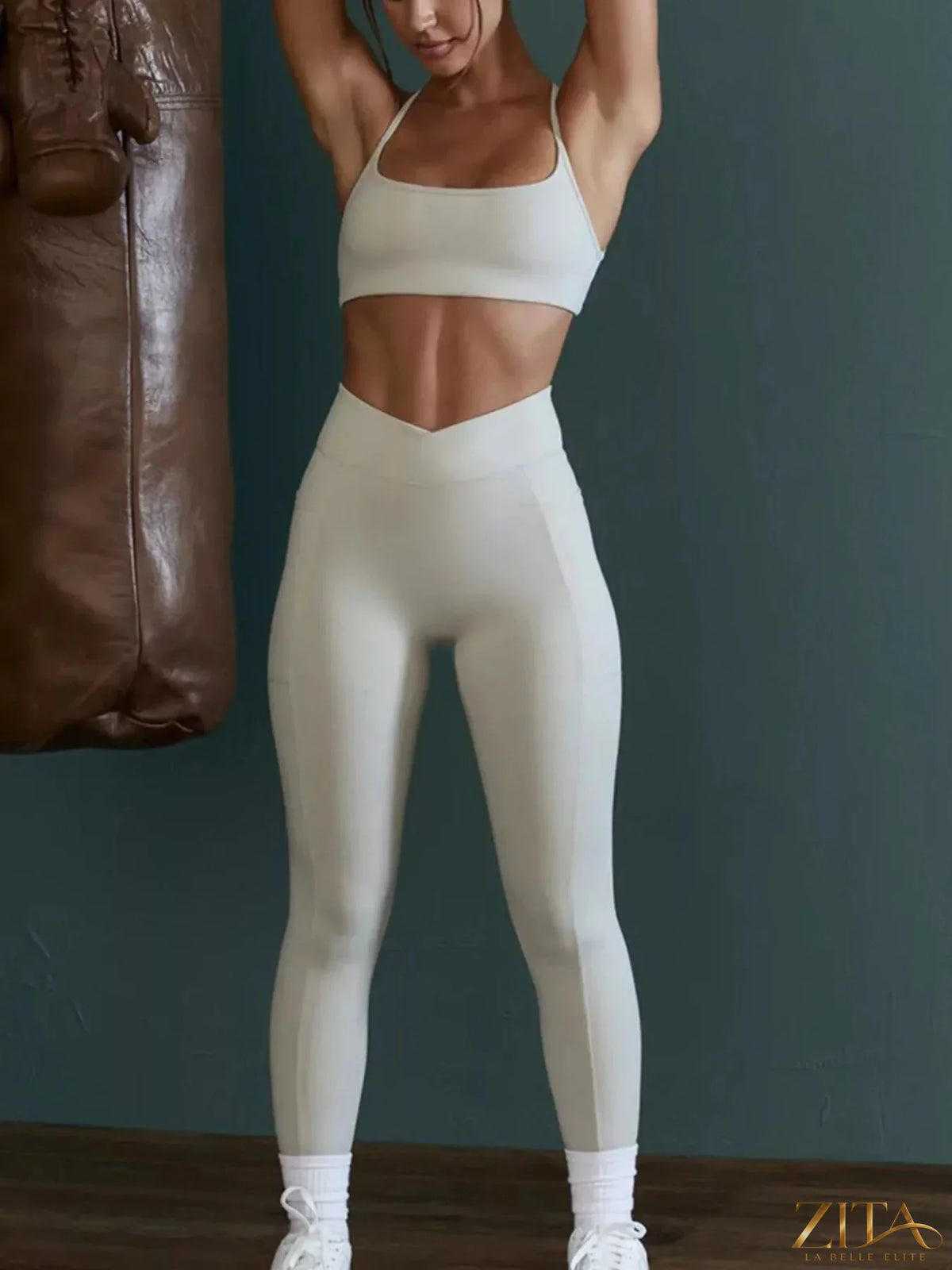 Zita La Belle Elite seamless cross-waist cami and leggings active set, black, form-fitting workout apparel on a model.