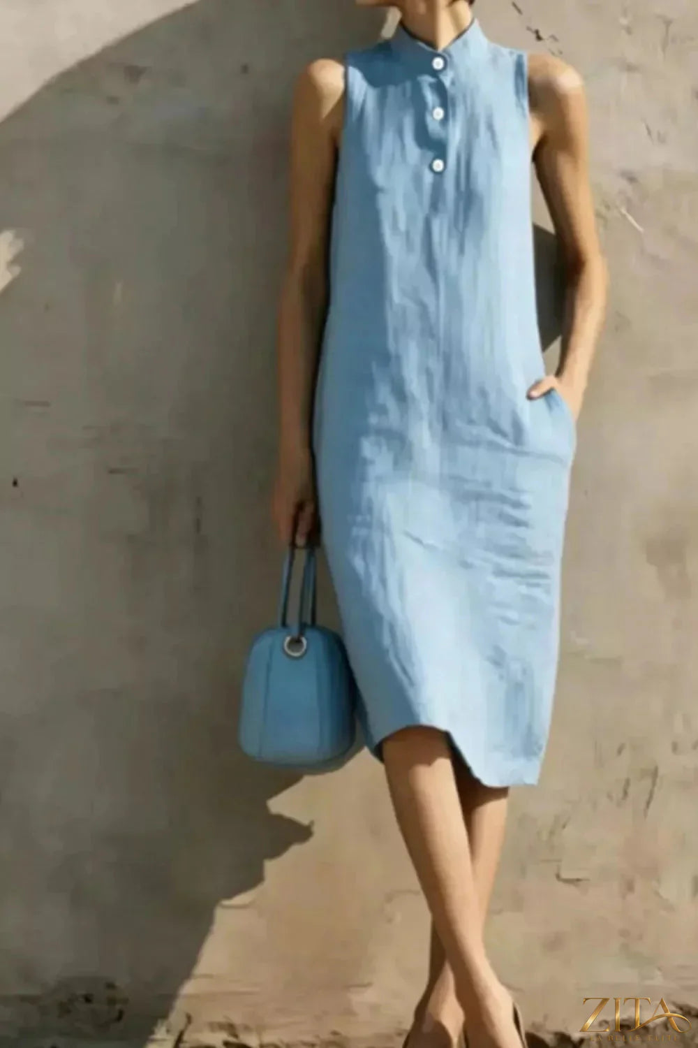 Casual sleeveless midi dress by Zita La Belle Elite with button details, flowing fabric, and a relaxed fit, ideal for warm-weather wear.