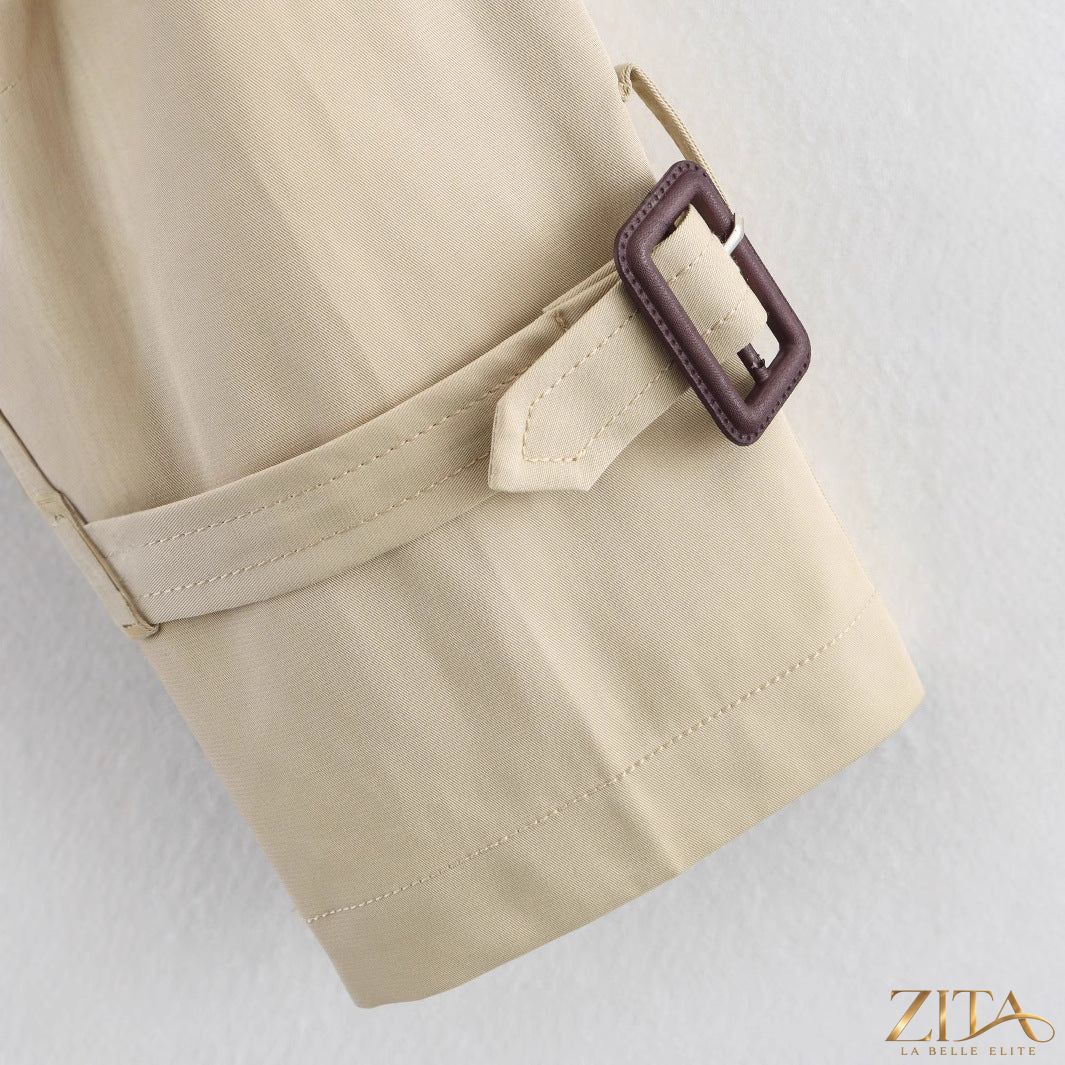 Women's short trench coat with notch collar and belt buckle detail, stylish jacket by Zita La Belle Elite.