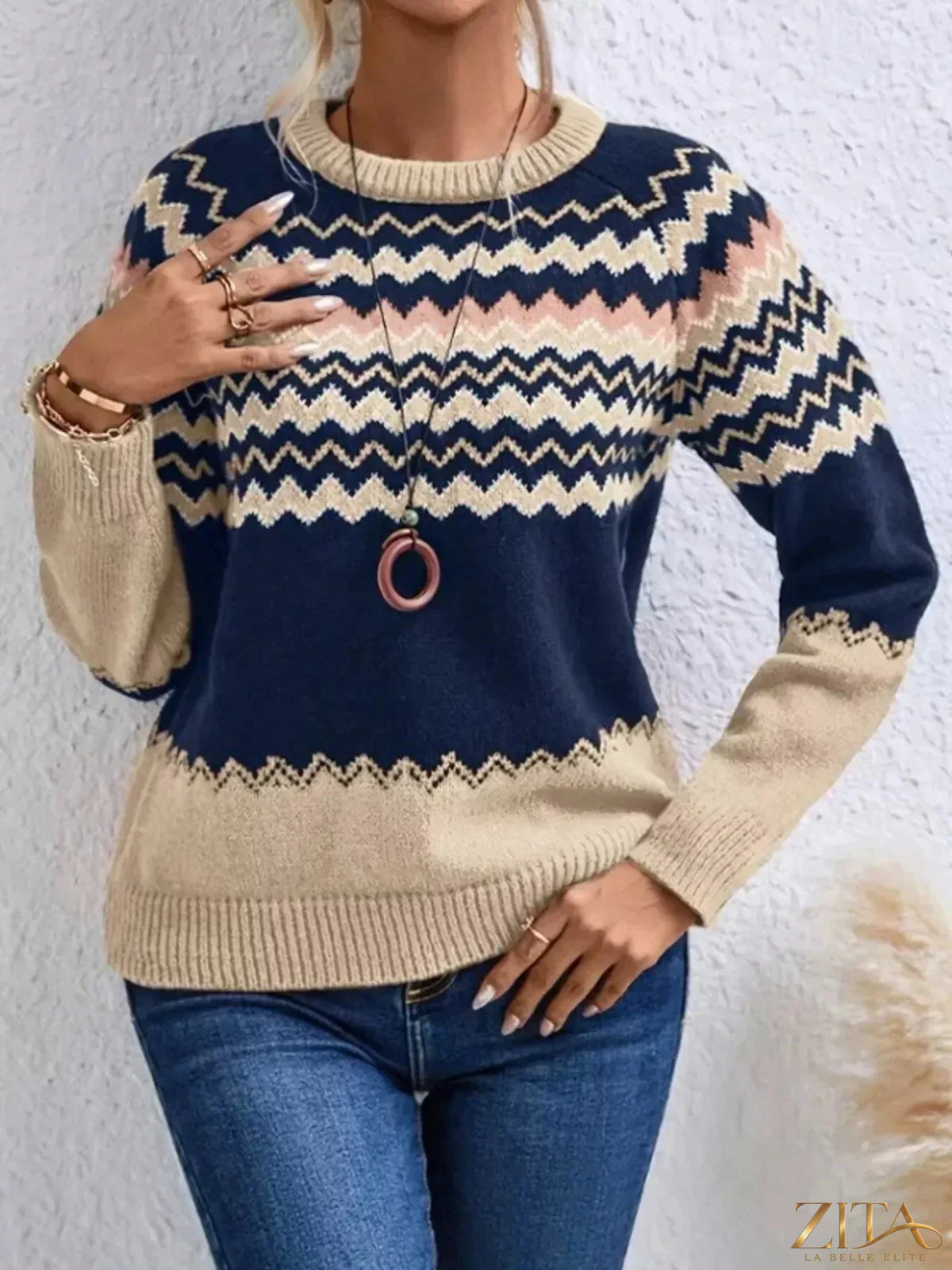 Geometric pattern knitted sweater by Trendsi featuring a stylish design and cozy fabric, perfect for casual wear.