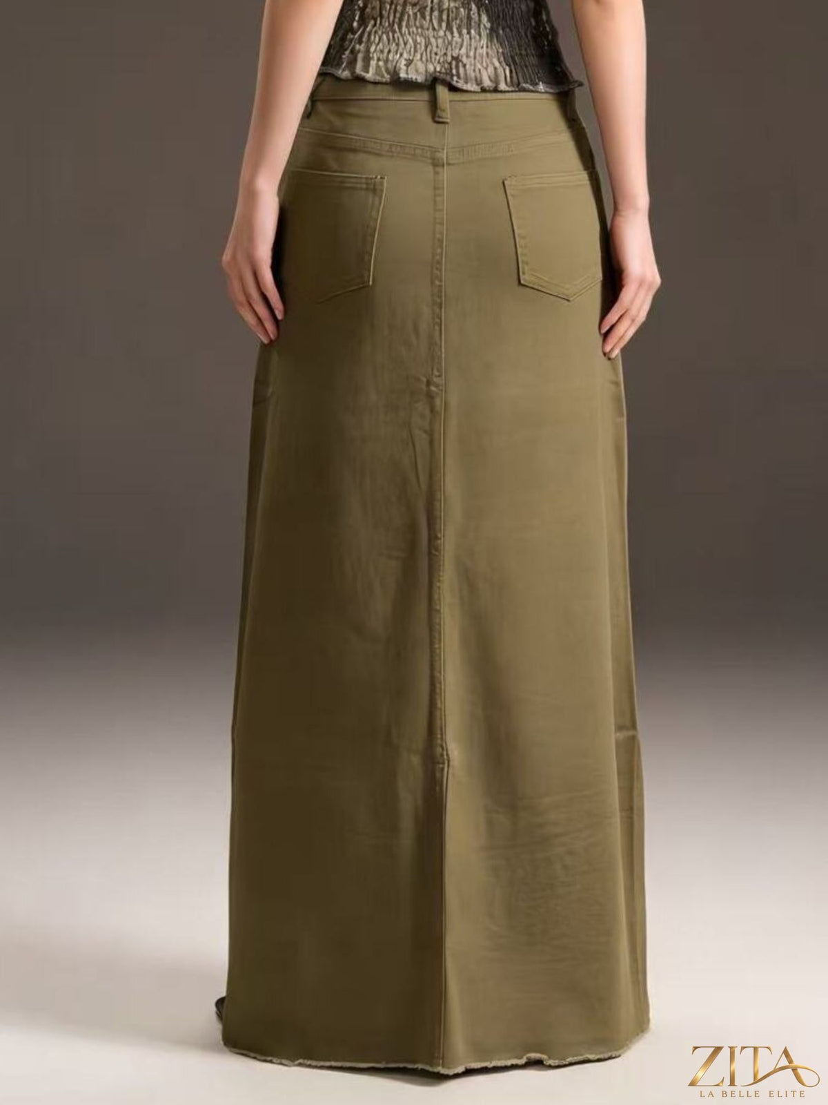Raw hem maxi denim skirt by Zita La Belle Elite, featuring a flowing silhouette and distressed raw hem design.