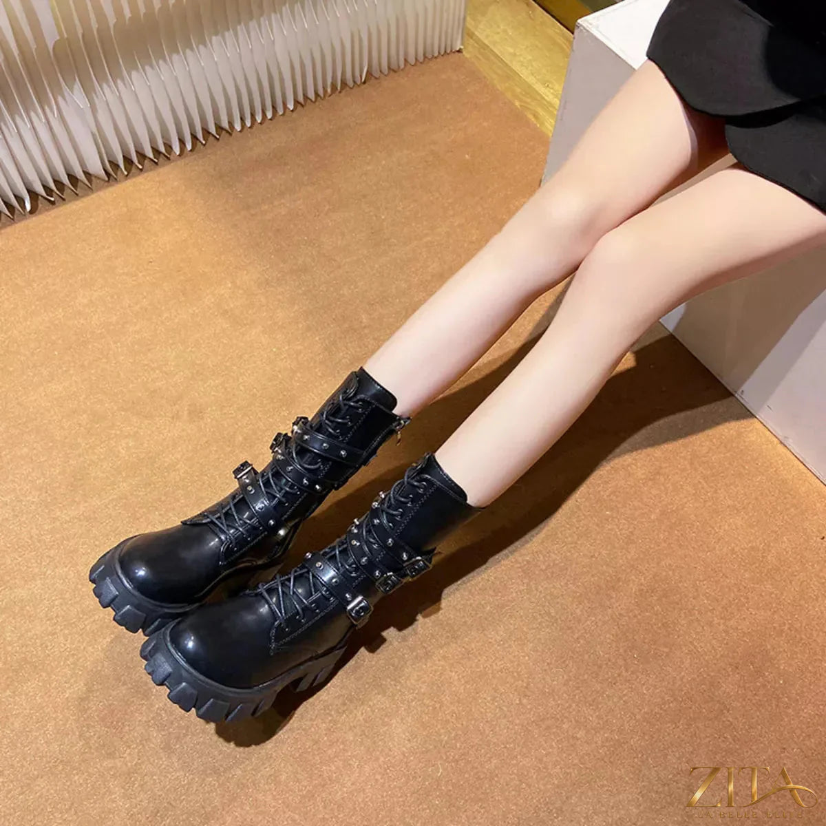 Black buckled lace-up combat boots by Trendsi featuring chunky soles and silver buckle accents.