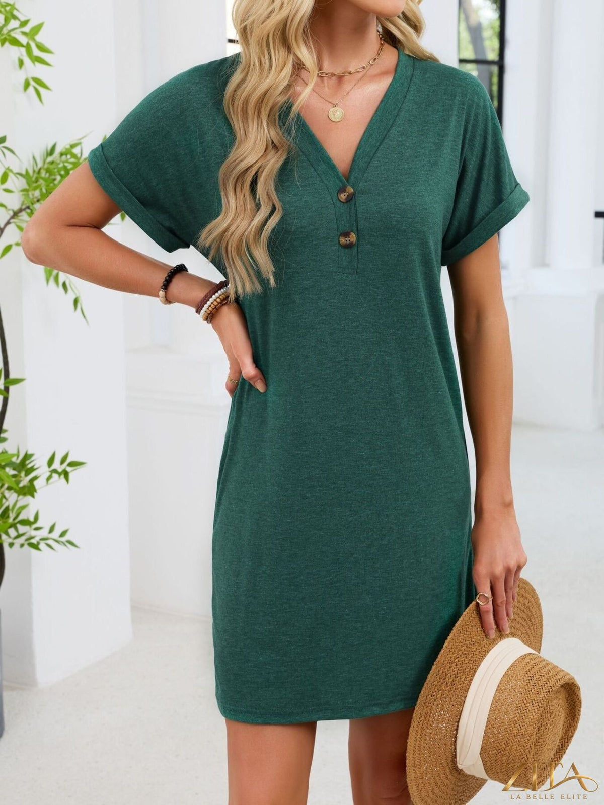 Zita La Belle Elite casual V-neck short sleeve T-shirt dress hanging on a wooden hanger, soft fabric and relaxed fit.