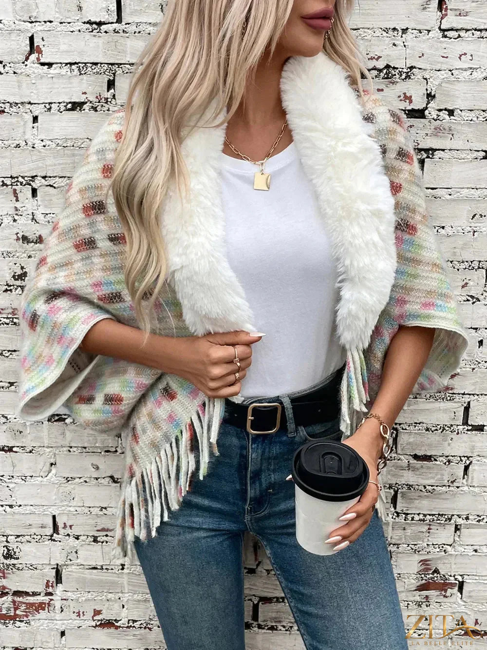Fuzzy open front poncho with fringe details in neutral tones, stylish and cozy fashion by Trendsi.