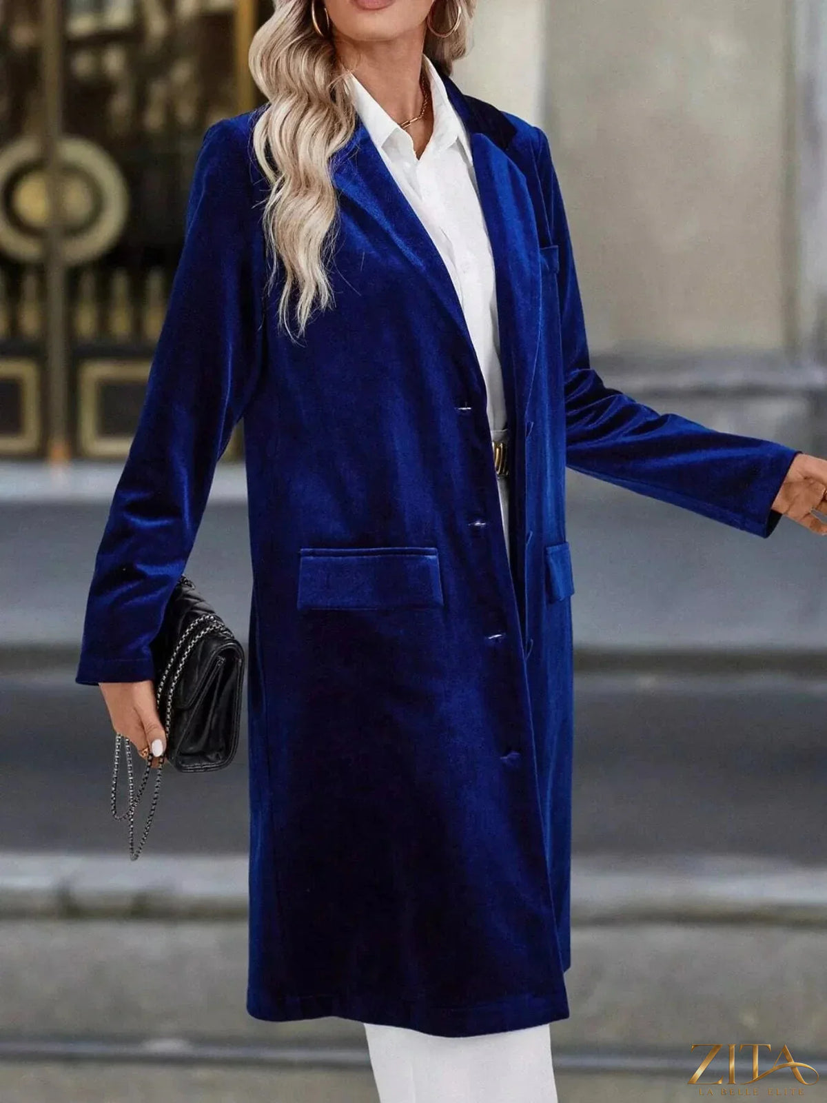 Zita La Belle Elite longline coat with lapel collar, long sleeves, and a stylish, tailored fit in a neutral fabric.