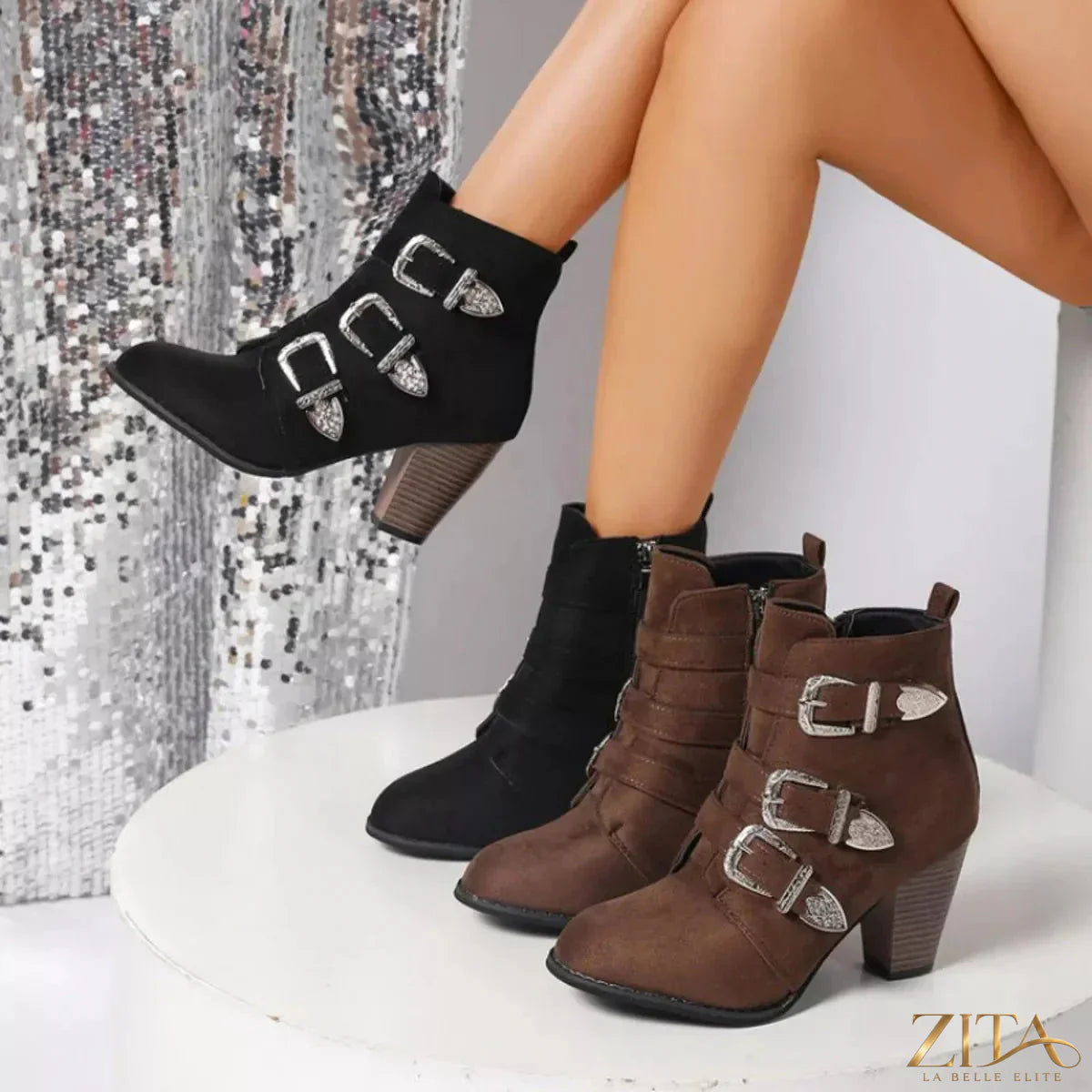 Point toe block heels boots by Trendsi featuring sleek design, ankle-high cut, and comfortable chunky heel in black leather.