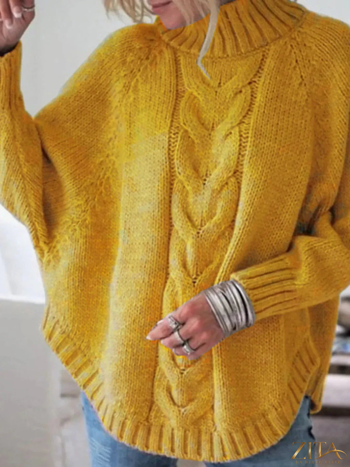 Zita La Belle Elite cable-knit long sleeve sweater in a cozy, textured knit fabric, displayed on a neutral background.