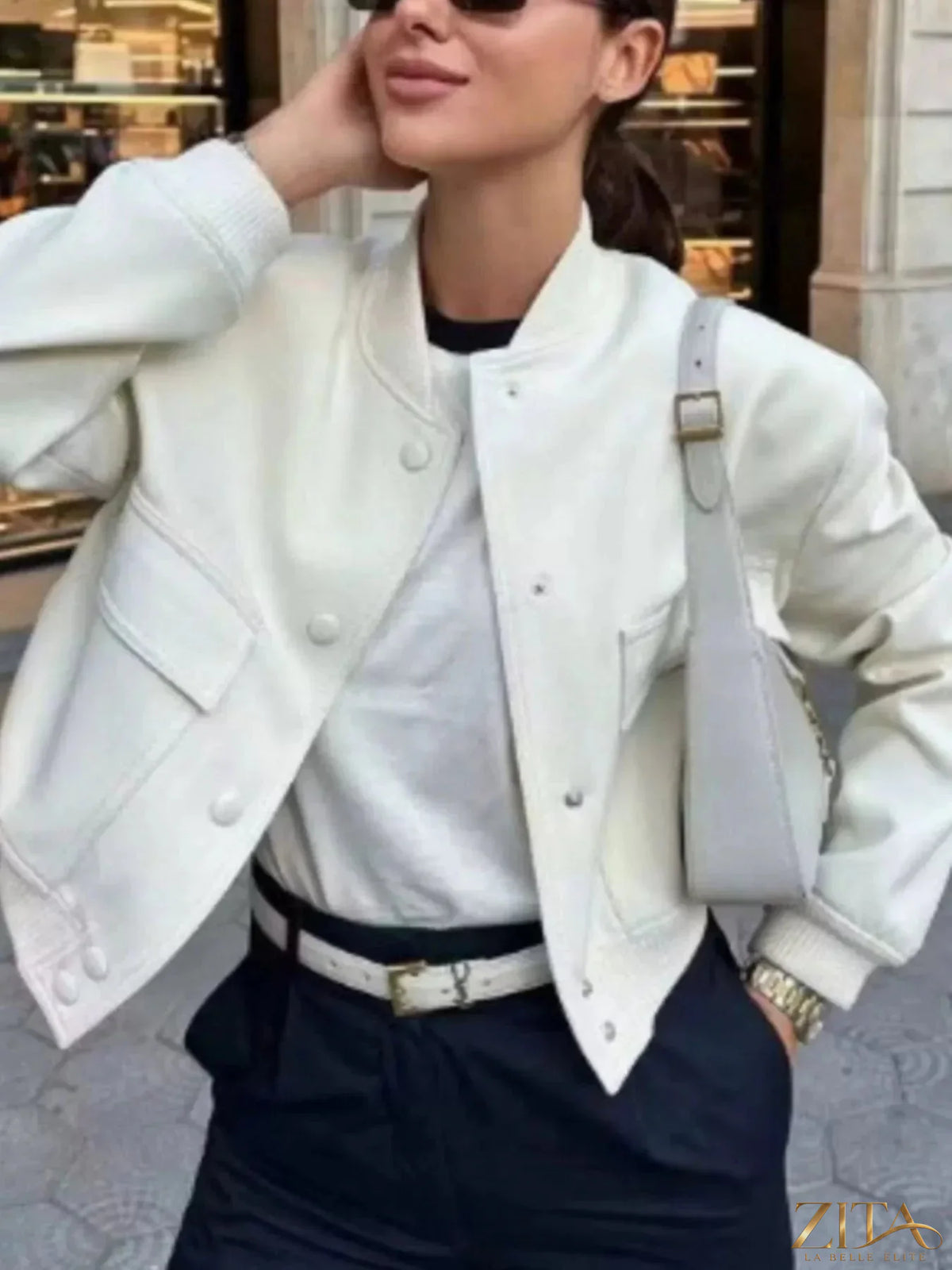 Zita La Belle Elite snap-down cropped bomber jacket in black, featuring a fitted style and ribbed cuffs and collar.