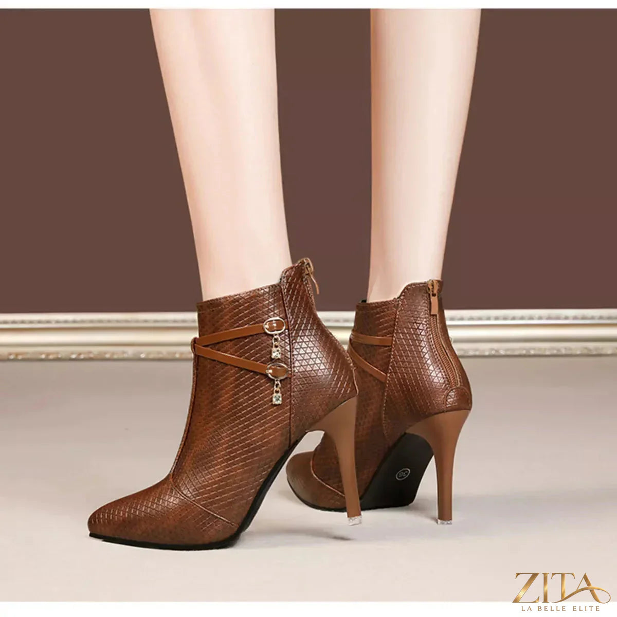 Black pointed-toe stiletto ankle boots by Zita La Belle Elite, featuring sleek design and high heel, on a white background.
