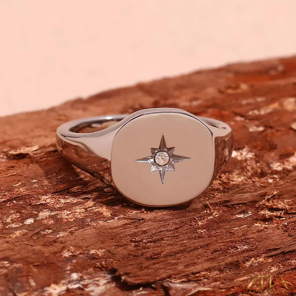 Minimalist North Star signet ring by Zita La Belle Elite showing a sleek silver band with engraved star design.