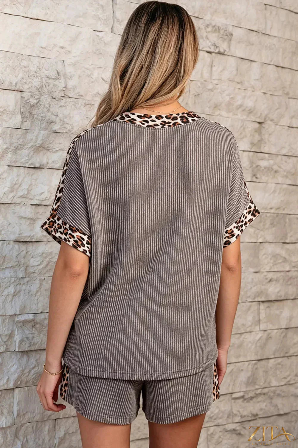 Leopard trim ribbed knit tee and shorts set by Trendsi, featuring a fitted top and matching shorts with leopard accents.