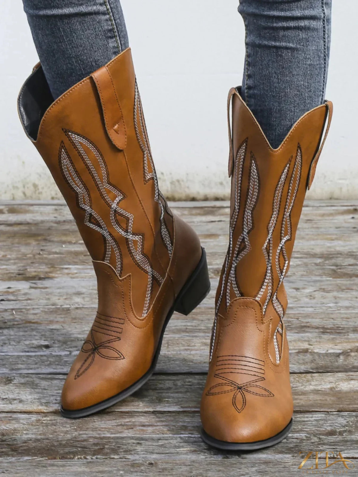 Western embroidered cowgirl boots with intricate floral embroidery and classic pointed toes, stylishly designed by Trendsi.