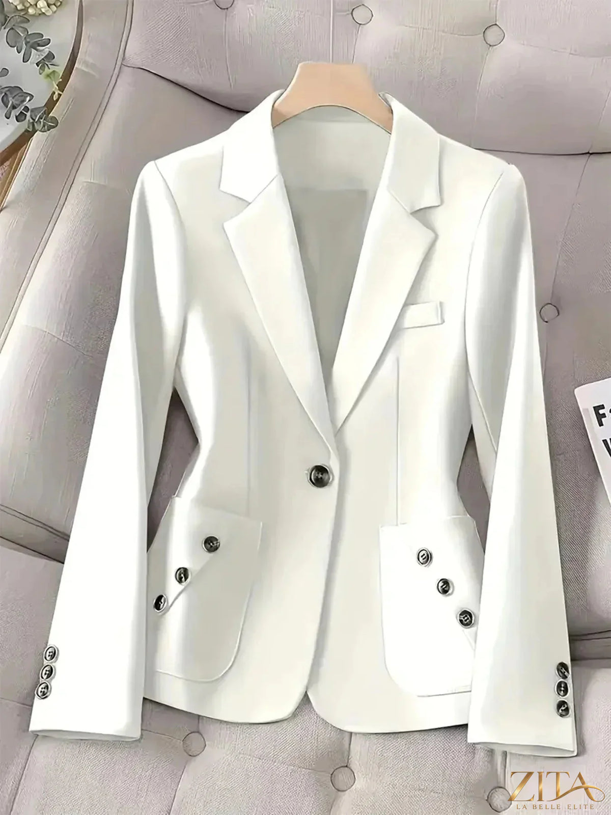 Black one-button blazer with front pockets, stylish and tailored, from Trendsi. Perfect for professional or casual outfits.