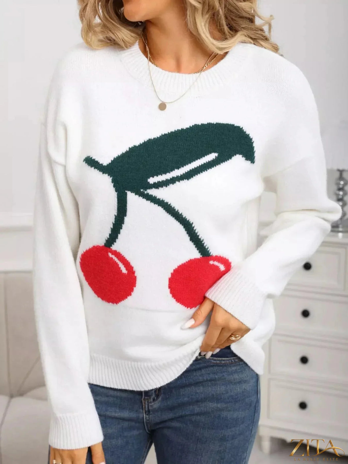 Cherry red round neck sweater by Trendsi, casual knit top with long sleeves and ribbed collar, styled on a model.