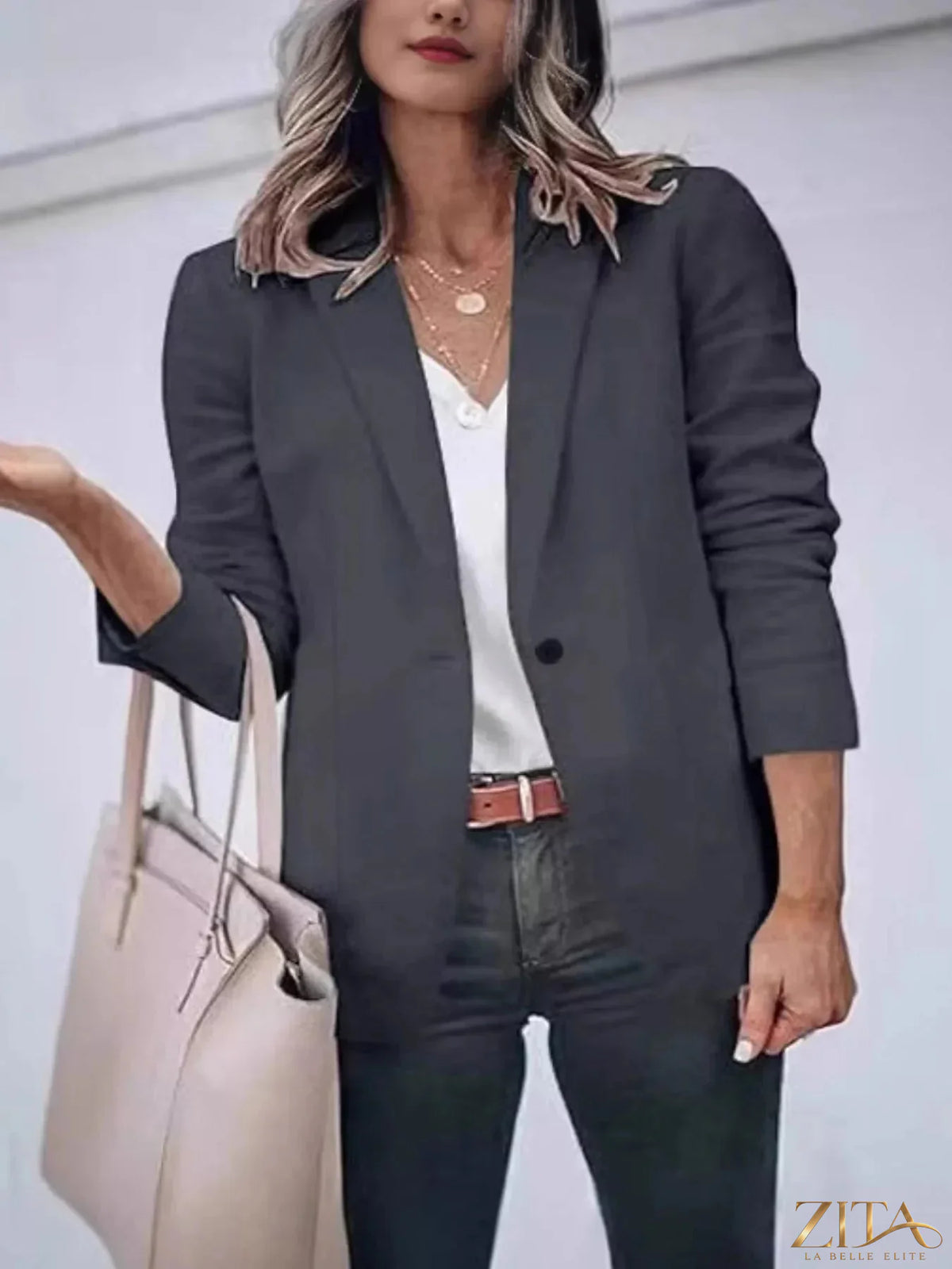 Slim-fit casual blazer with single button closure, Trendsi brand, in a sleek, tailored style perfect for smart-casual outfits.