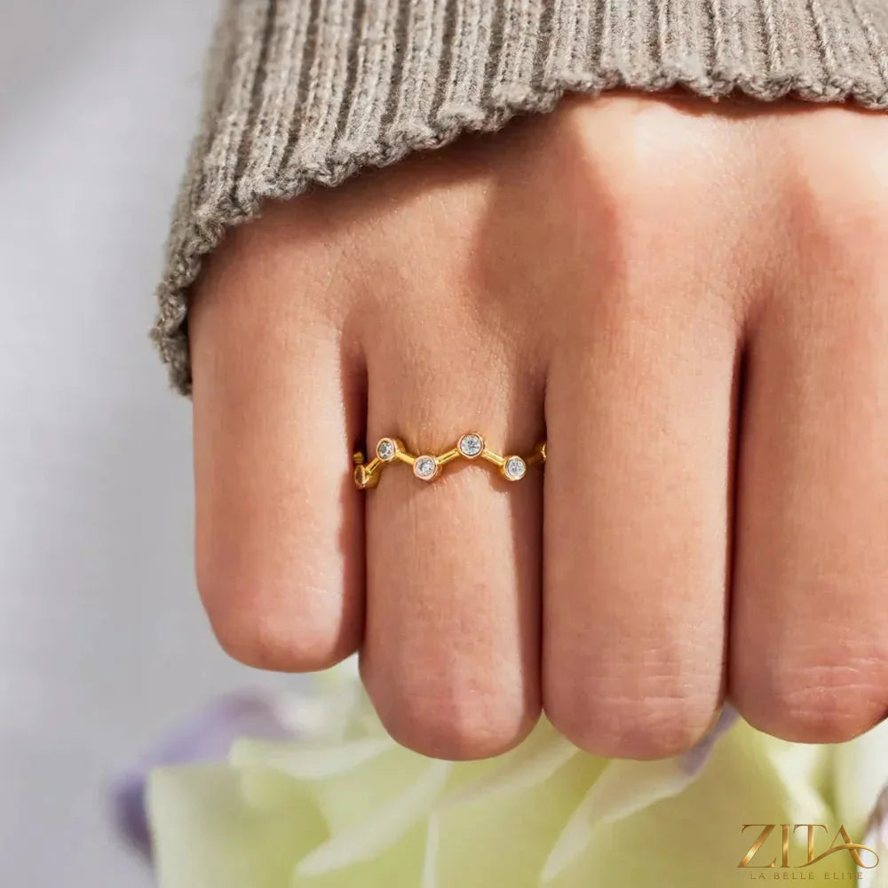 18K gold-plated sterling silver zircon ring by Zita La Belle Elite with sparkling zircon stones and intricate band design.