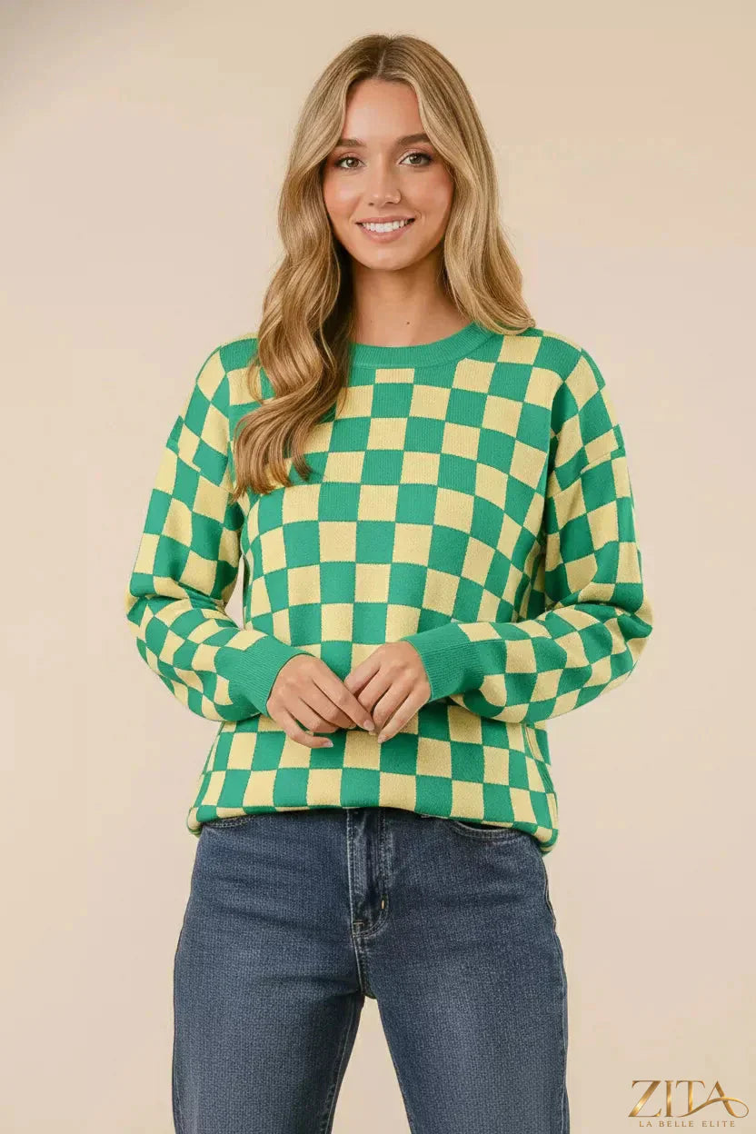 Checkered pattern sweater by Trendsi, featuring a stylish black and white design, soft knit fabric, and long sleeves.