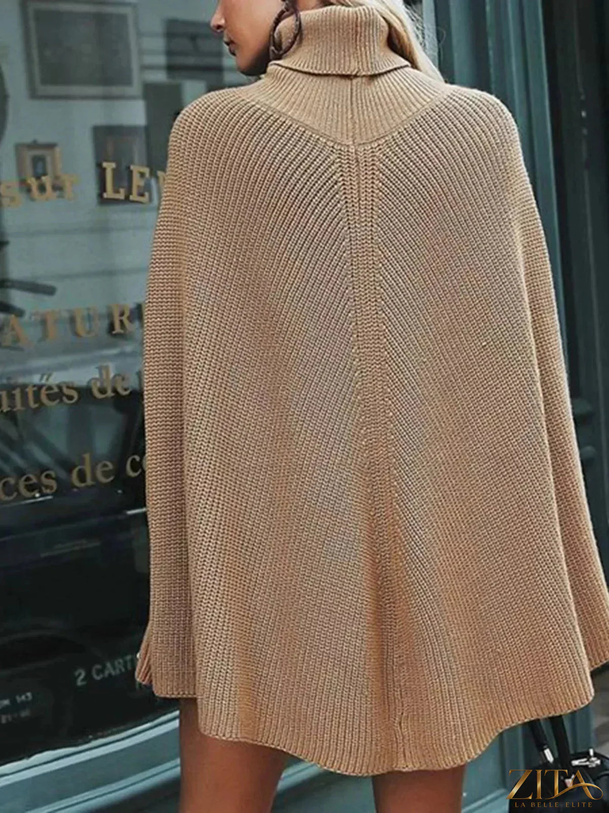 Zita La Belle Elite oversized turtleneck poncho sweater in cozy knit fabric, draped to showcase its relaxed fit and stylish design.