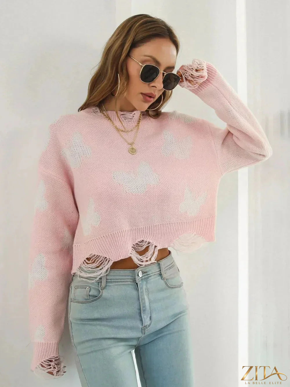 Zita La Belle Elite distressed butterfly cropped sweater with ripped details and a relaxed fit, displayed on a mannequin.