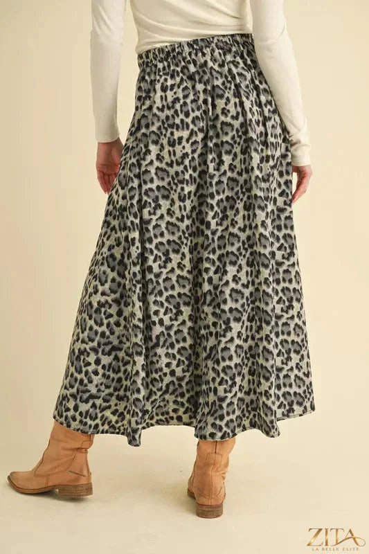 Leopard print Aemi+Co midi skirt from Trendsi featuring a flowy silhouette and stylish animal print fabric.