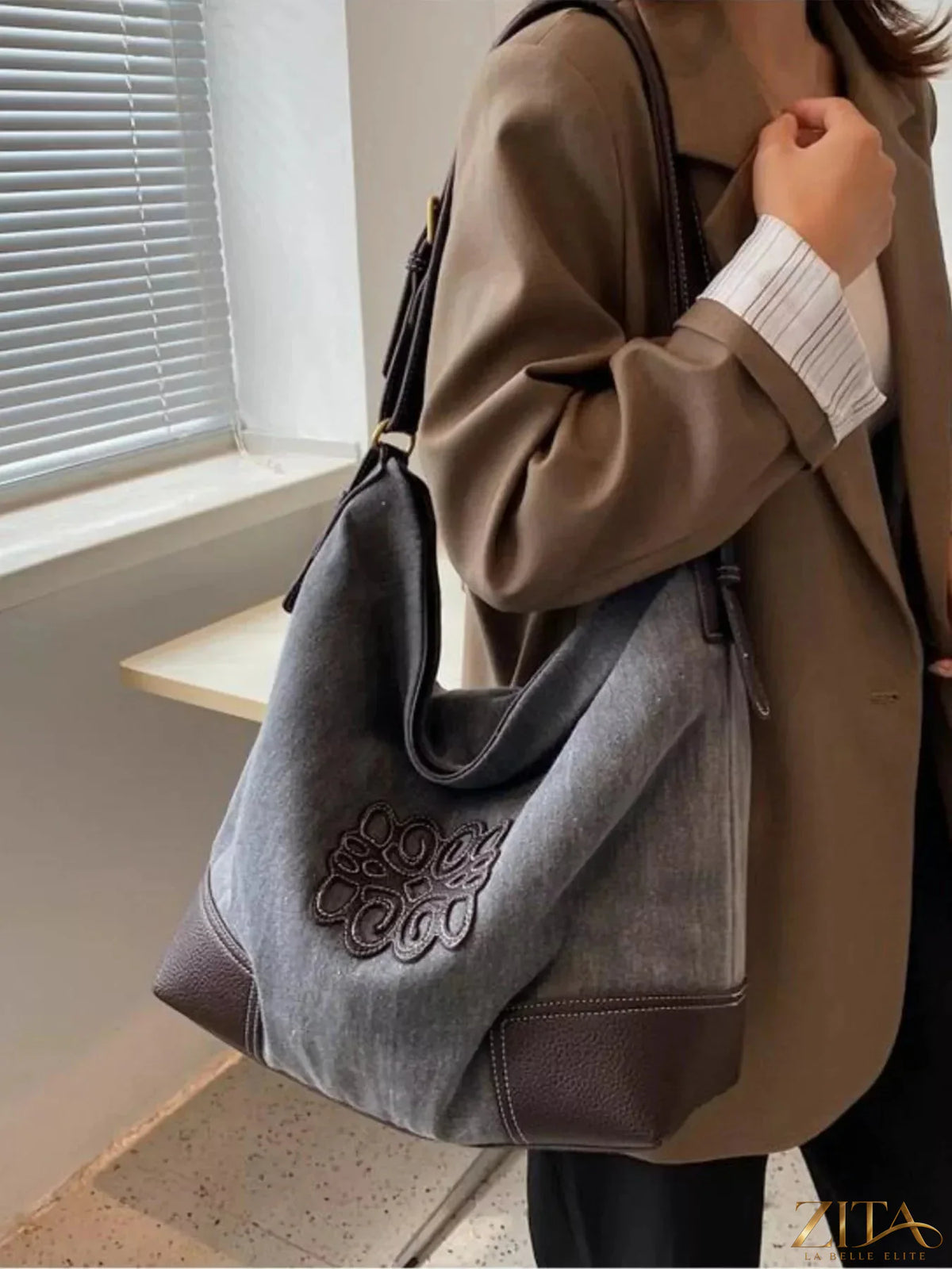 Embroidered canvas tote bag by Zita La Belle Elite with colorful floral embroidery and sturdy handles for casual carrying.