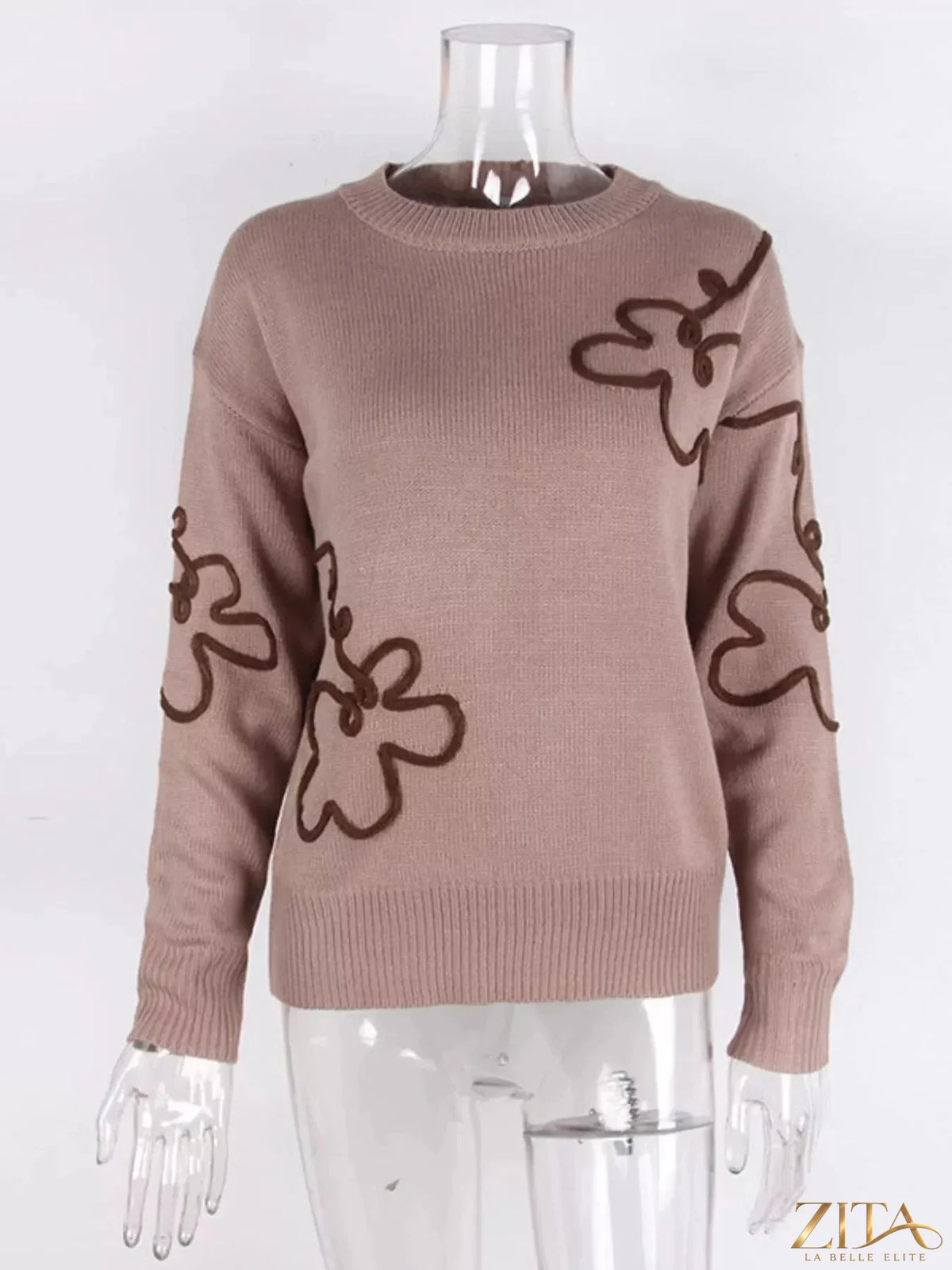Flower dropped shoulder sweater by Trendsi, featuring a floral design and relaxed fit on a model.