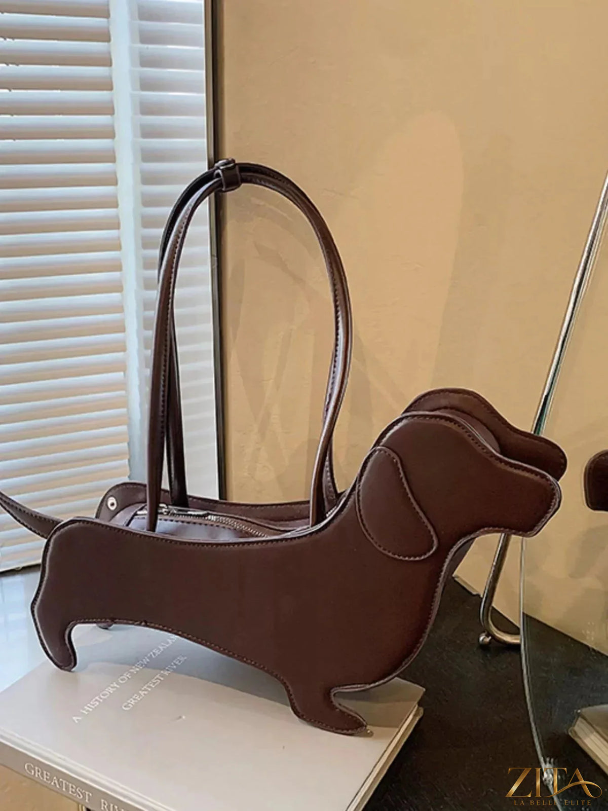 Zita La Belle Elite dachshund-shaped shoulder bag with detailed features and adjustable strap, stylish accessory for casual wear.