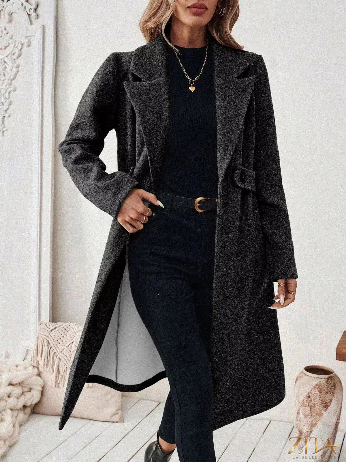 Zita La Belle Elite one button lapel collar overcoat hanging on a wooden hanger, tailored with a sleek lapel collar and classic design.
