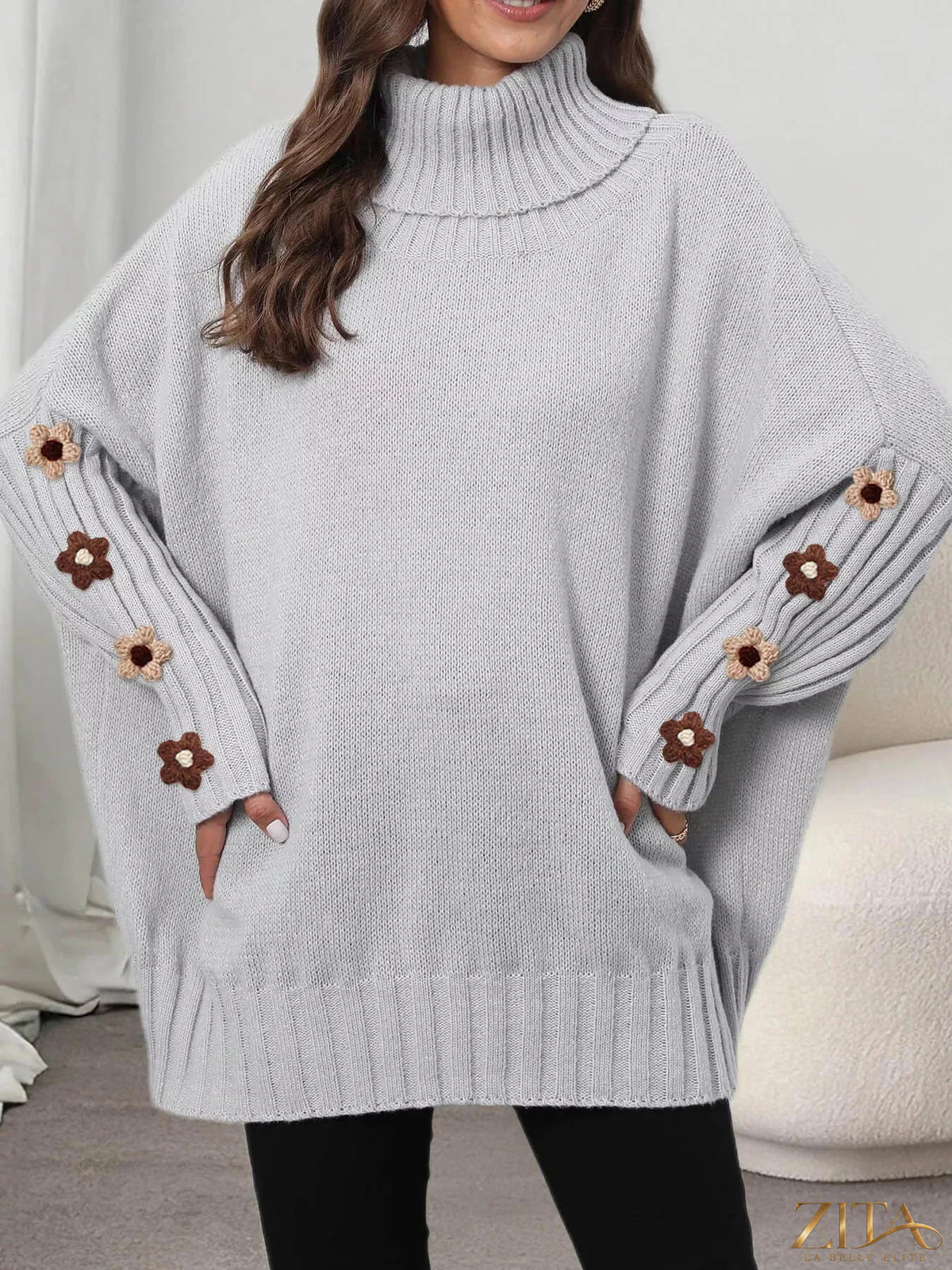 Zita La Belle Elite oversized turtleneck sweater with floral applique sleeves, cozy knit design and stylish fall fashion.