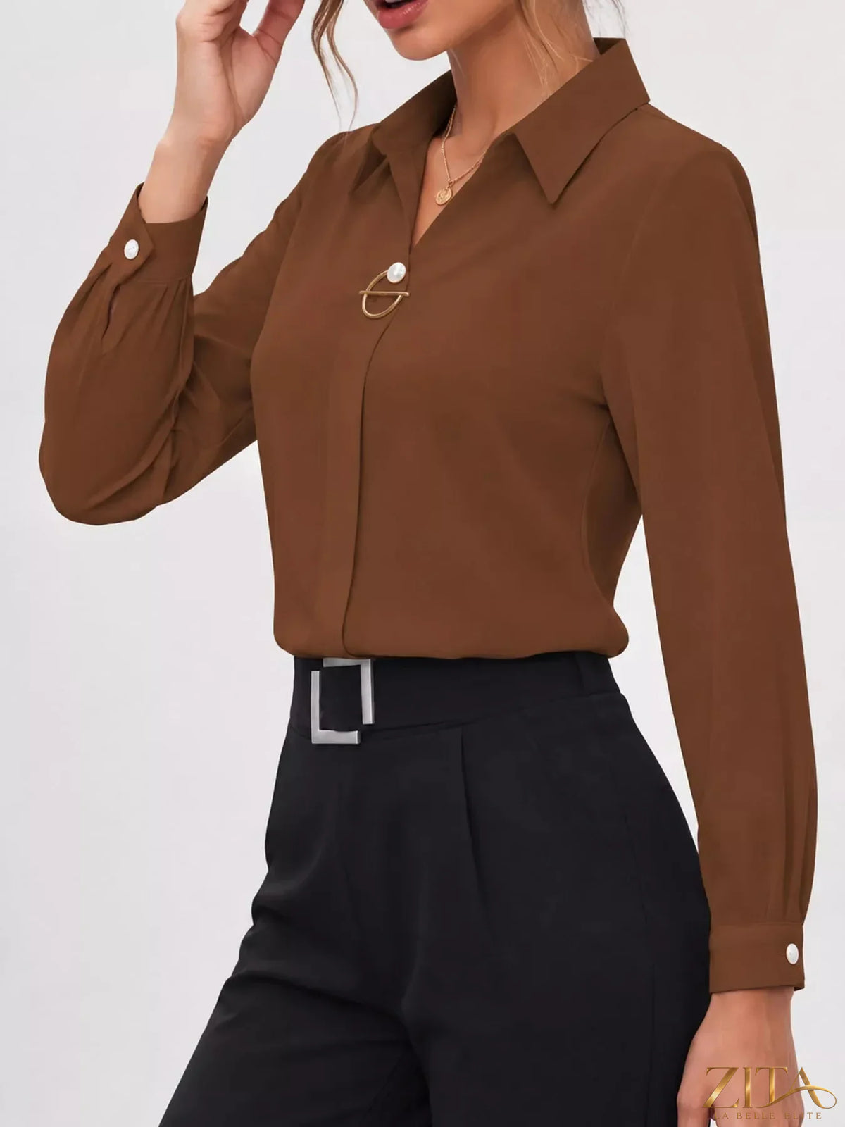Long sleeve satin blouse by Zita La Belle Elite, featuring a smooth, shiny fabric and elegant design with a collar and button front.