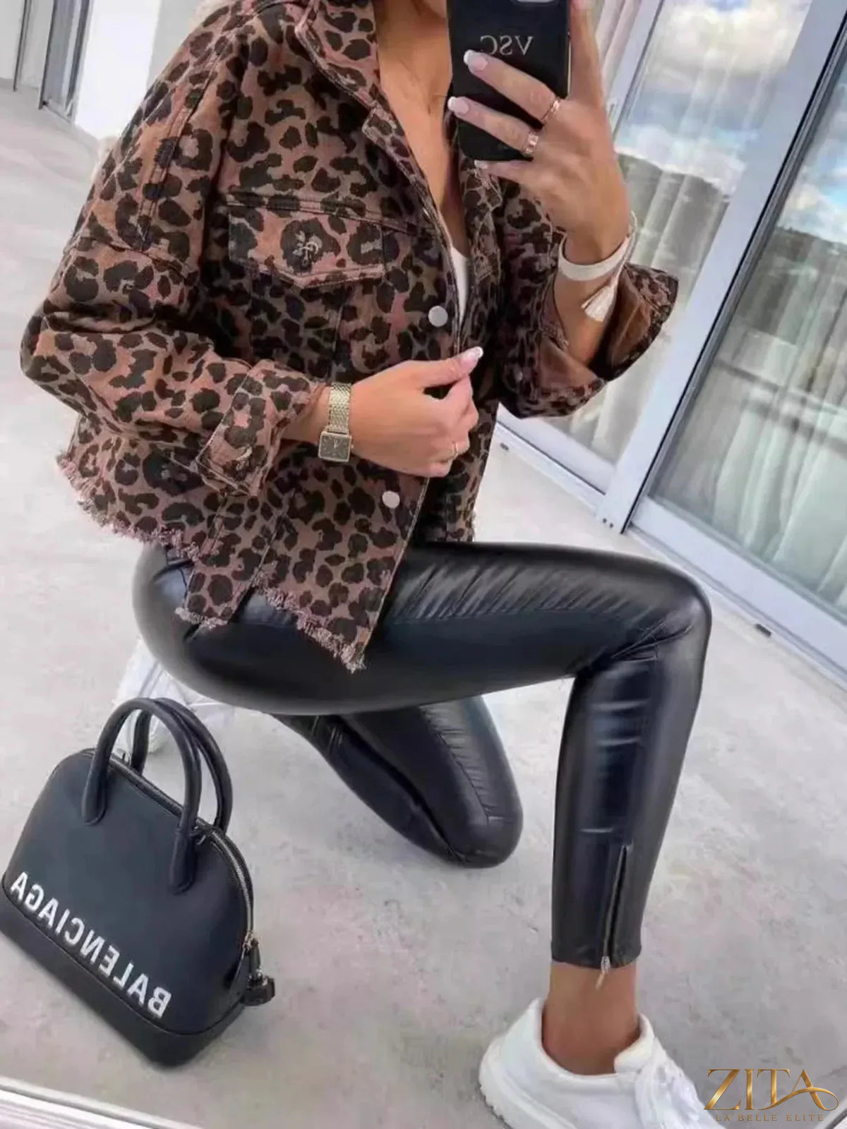 Leopard print raw hem denim jacket by Zita La Belle Elite, featuring classic denim with animal print pattern and distressed hem detail.