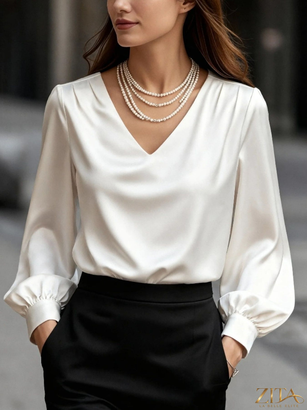 Zita La Belle Elite satin V-neck long sleeve blouse in elegant fabric, showcased on a hanger with a soft background.