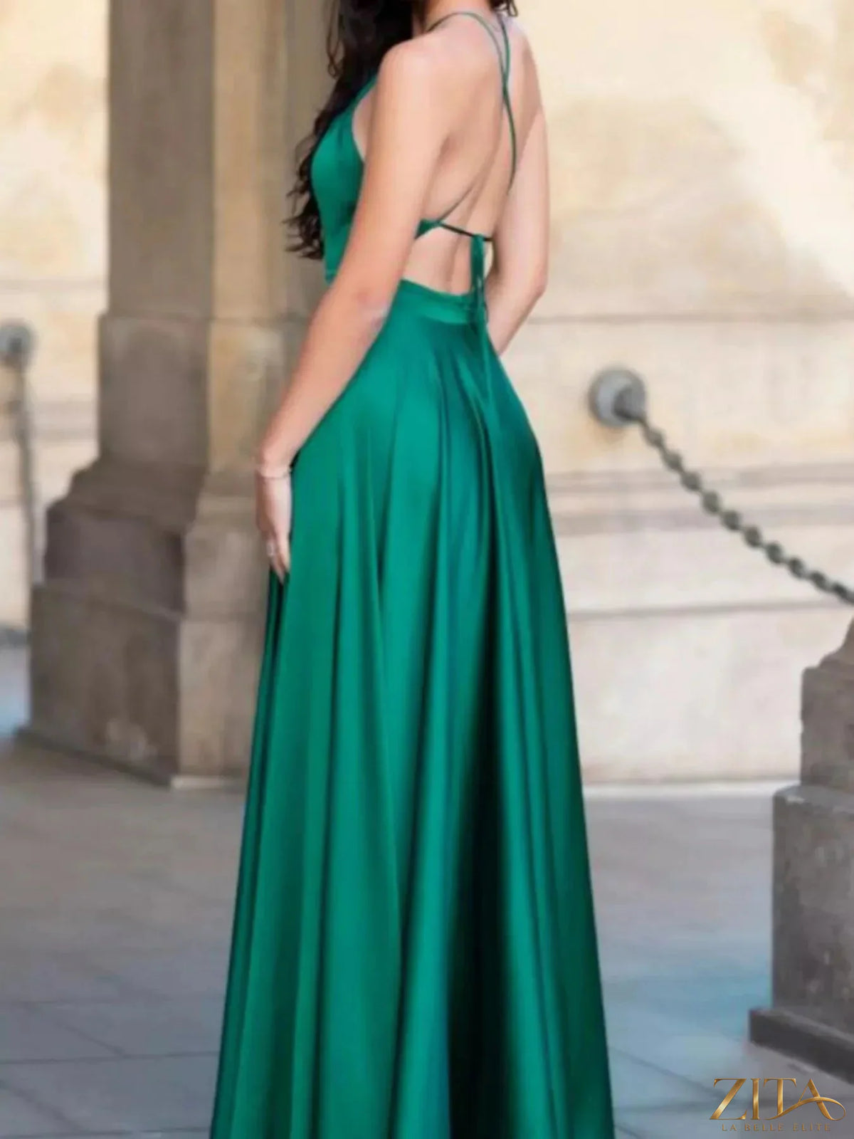 Zita La Belle Elite halter neck slit maxi dress in flowing fabric, featuring a stylish open-back design and elegant silhouette.