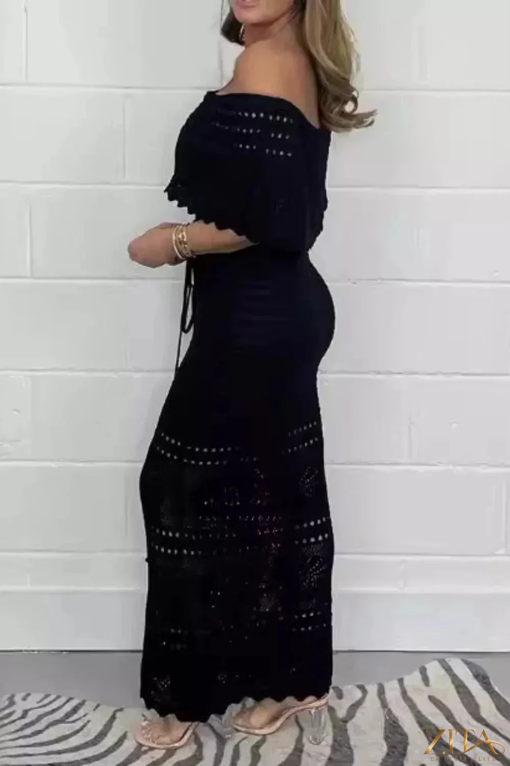 Crochet off-shoulder maxi dress by Zita La Belle Elite featuring intricate lace details and flowing fabric for elegant summer wear.