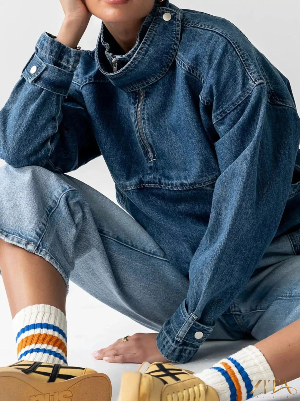 Zita La Belle Elite half-zip turtleneck denim top, close-up showing the zipper detail and classic denim fabric.