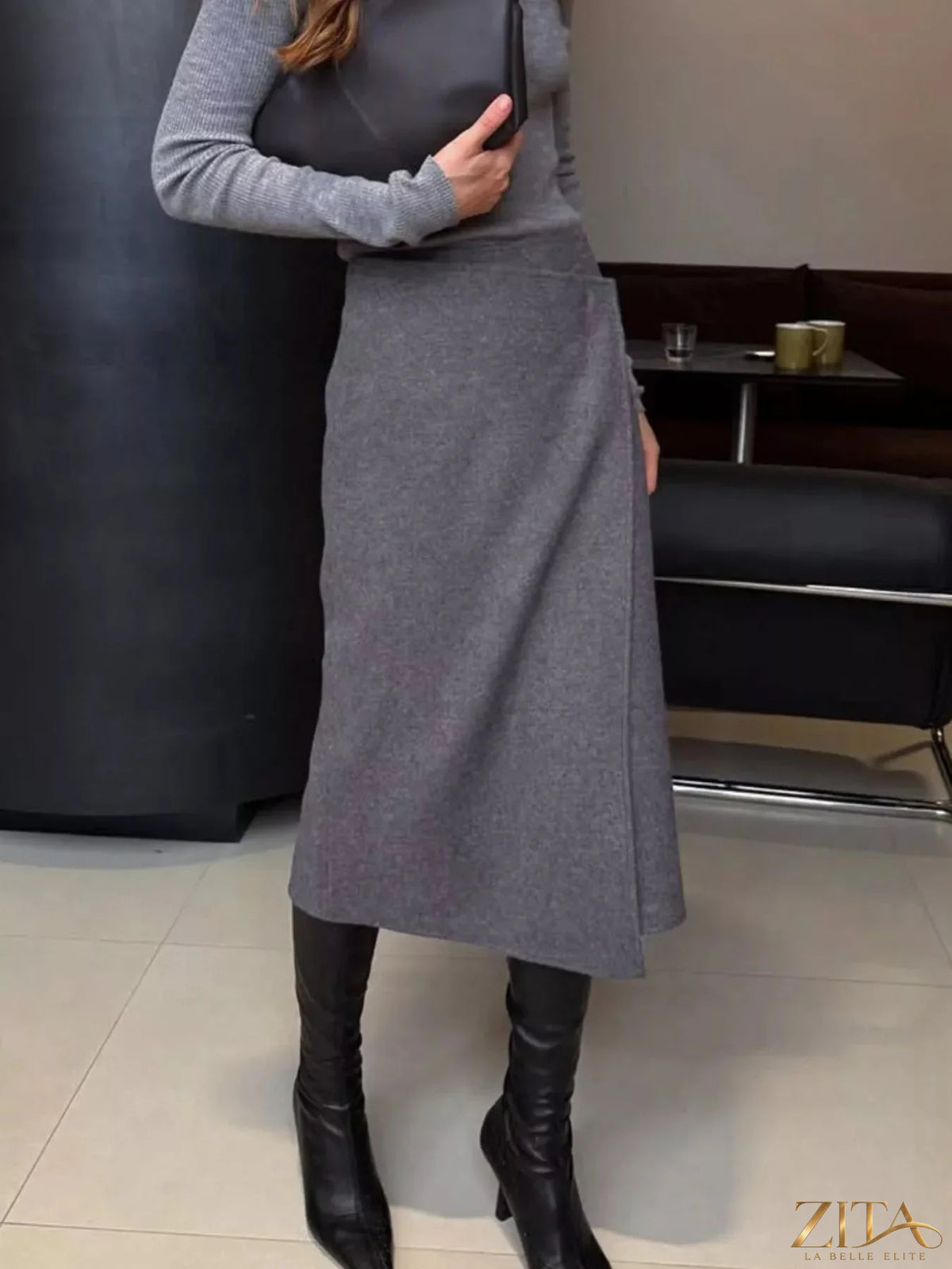 High-waisted wrap midi skirt by Trendsi, featuring a stylish design and flowy fabric, shown in a natural drape in the image.